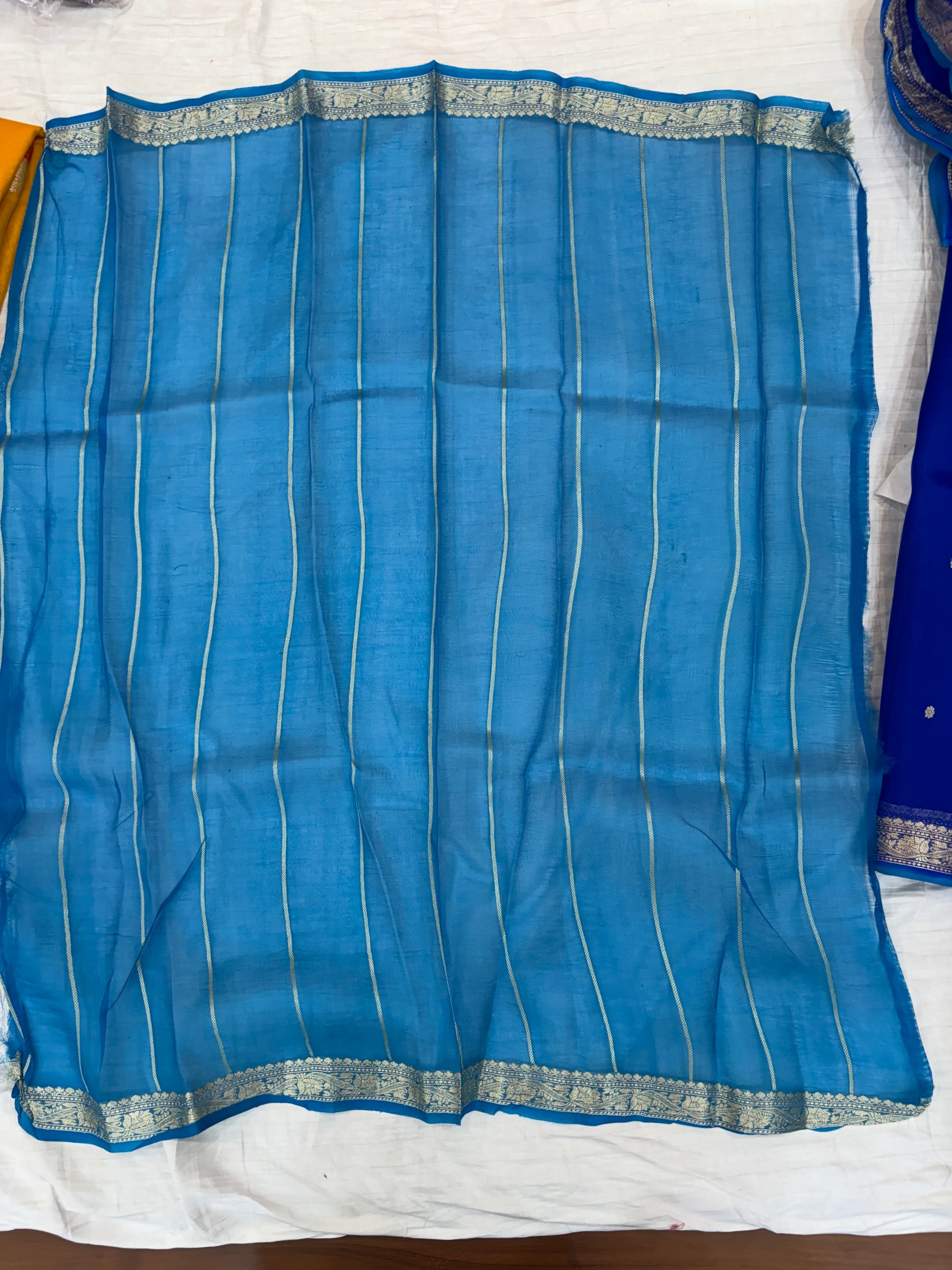 Pure handloom organza silk saree In Royal blue colour with Turquoise blue piping border