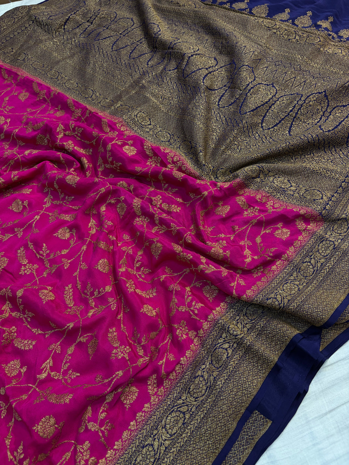 Pure khaddi crepe silk saree with all over jaal work in Rani with navy blue colour combination