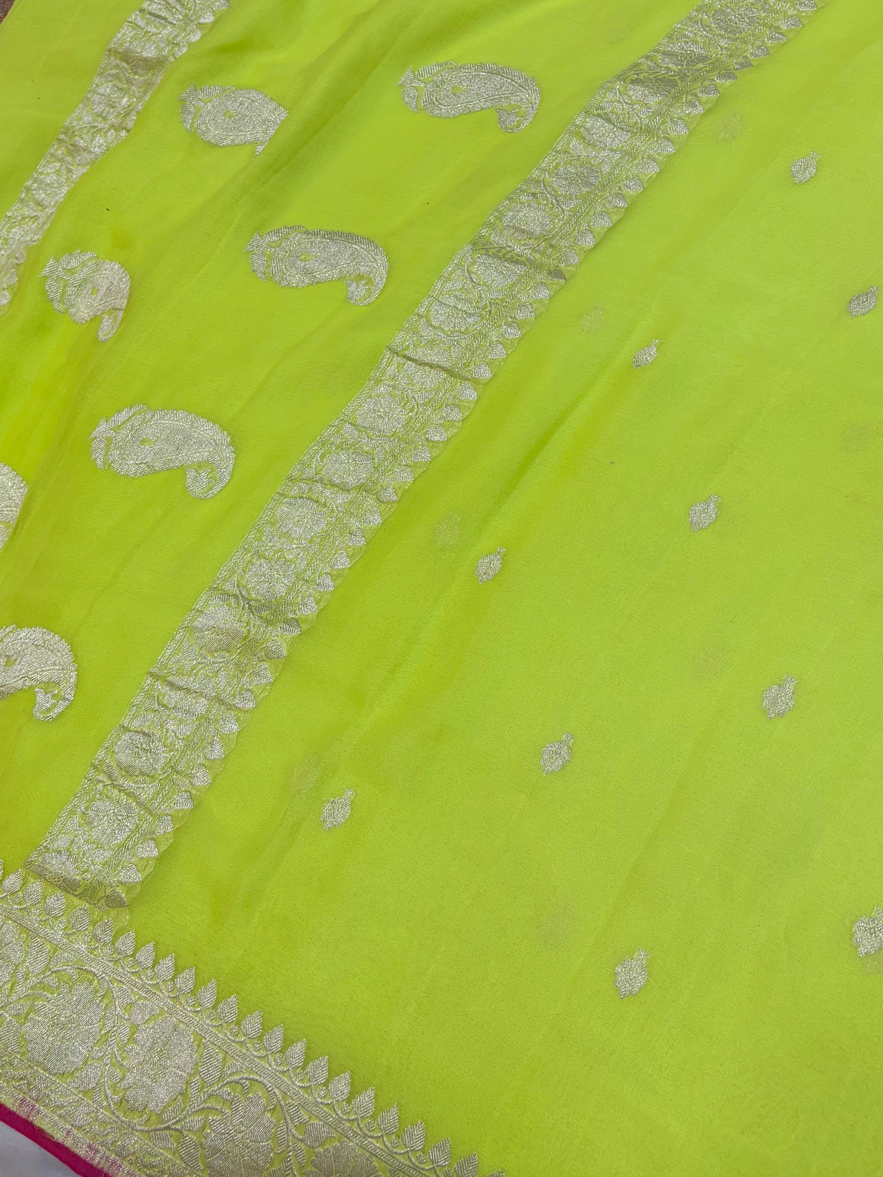 Pure khaddi chiffon saree in neon green colour with Rani pink piping border