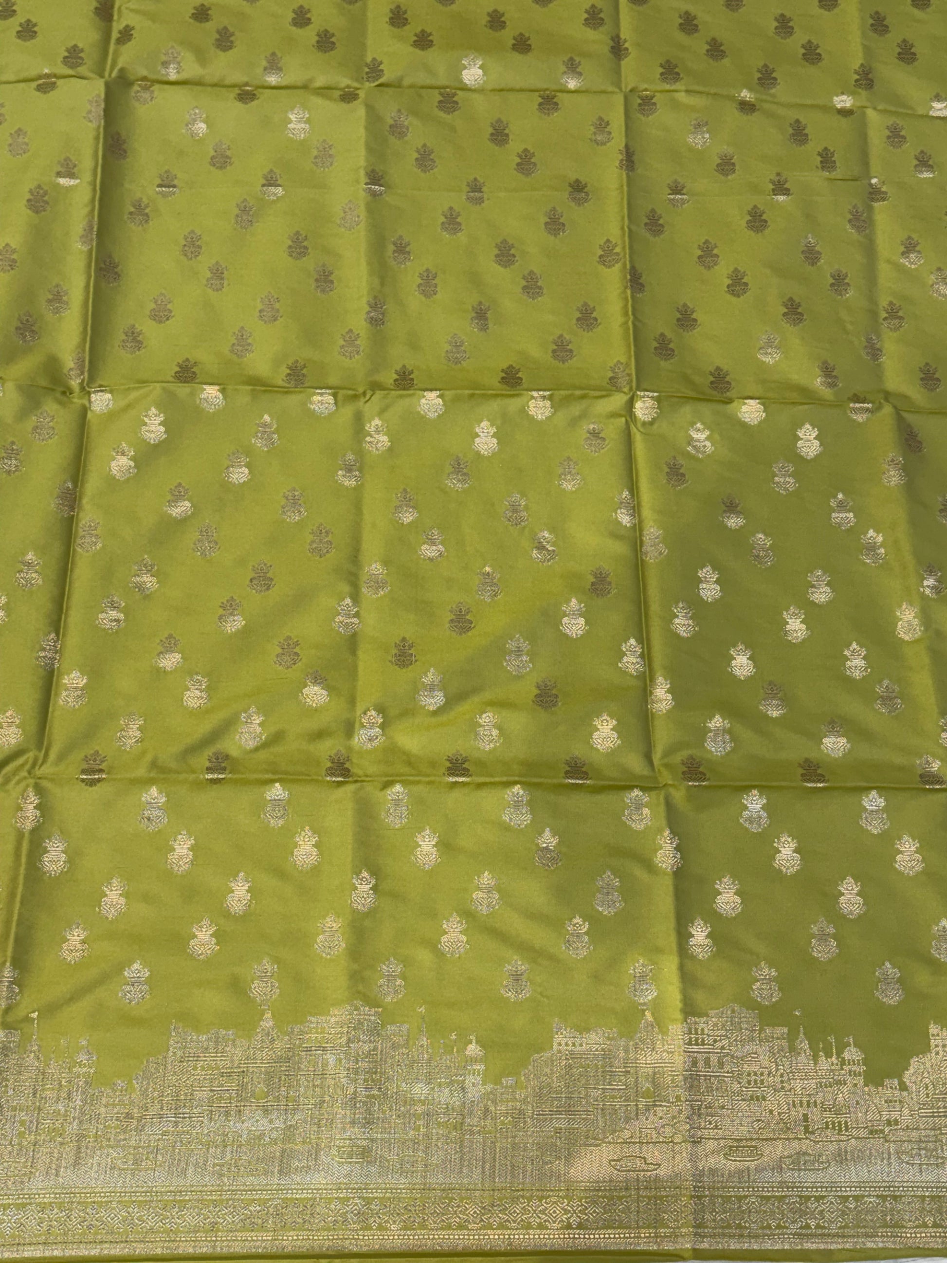 Banarasi soft silk suit in Lime green colour with temple design work