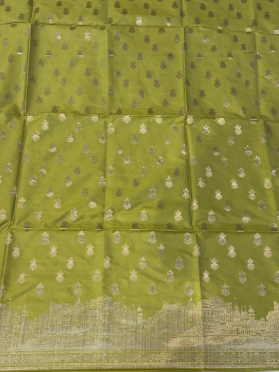 Banarasi soft silk suit in Lime green colour with temple design work