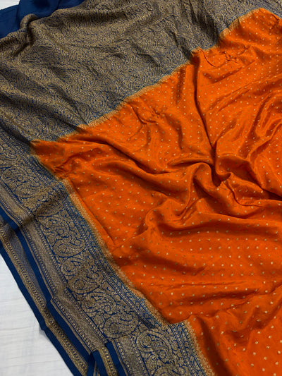 Pure khaddi crepe silk saree in Rust orange with navy blue colour