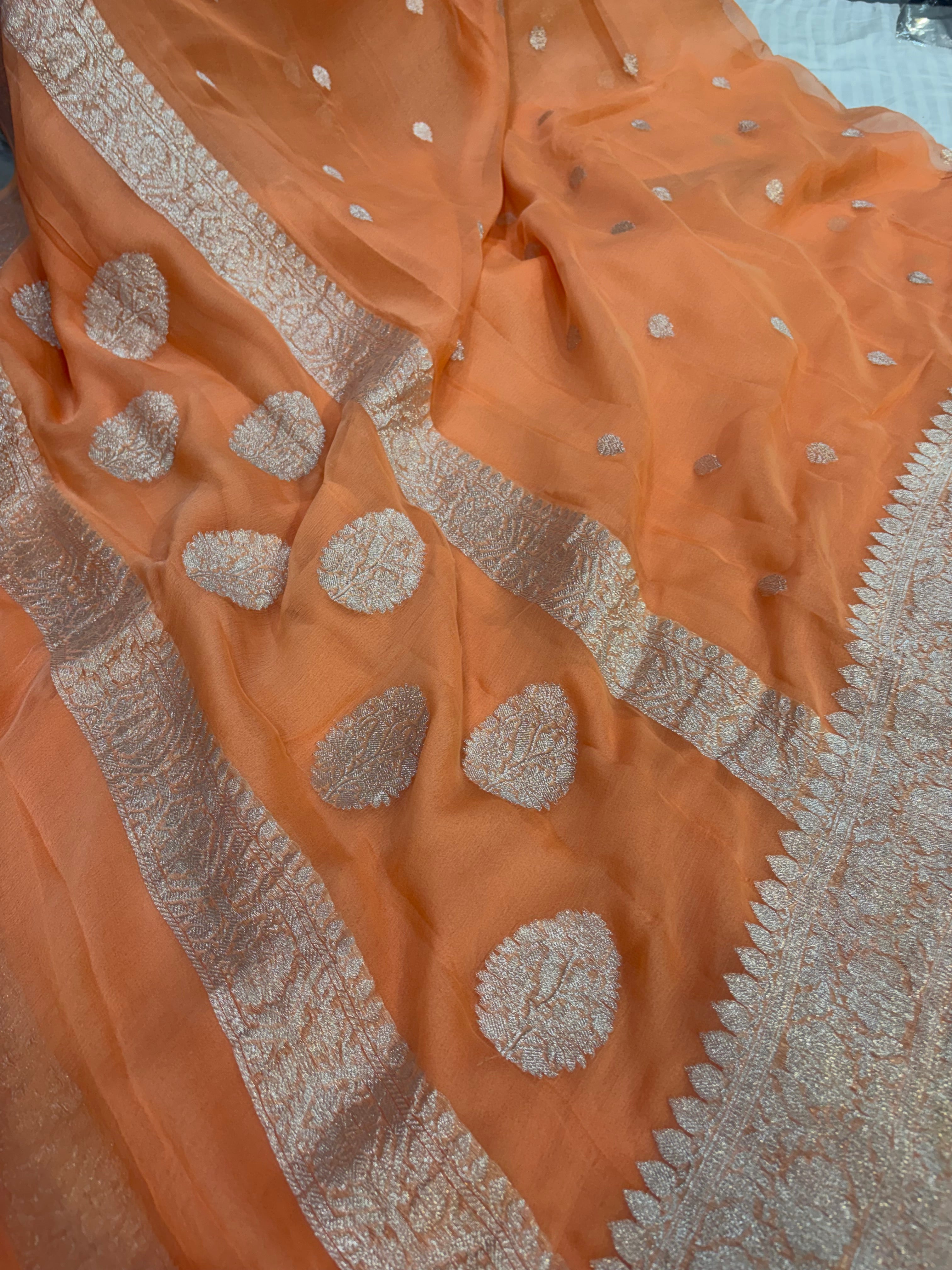 Pure khaddi chiffon saree in coral orange colour