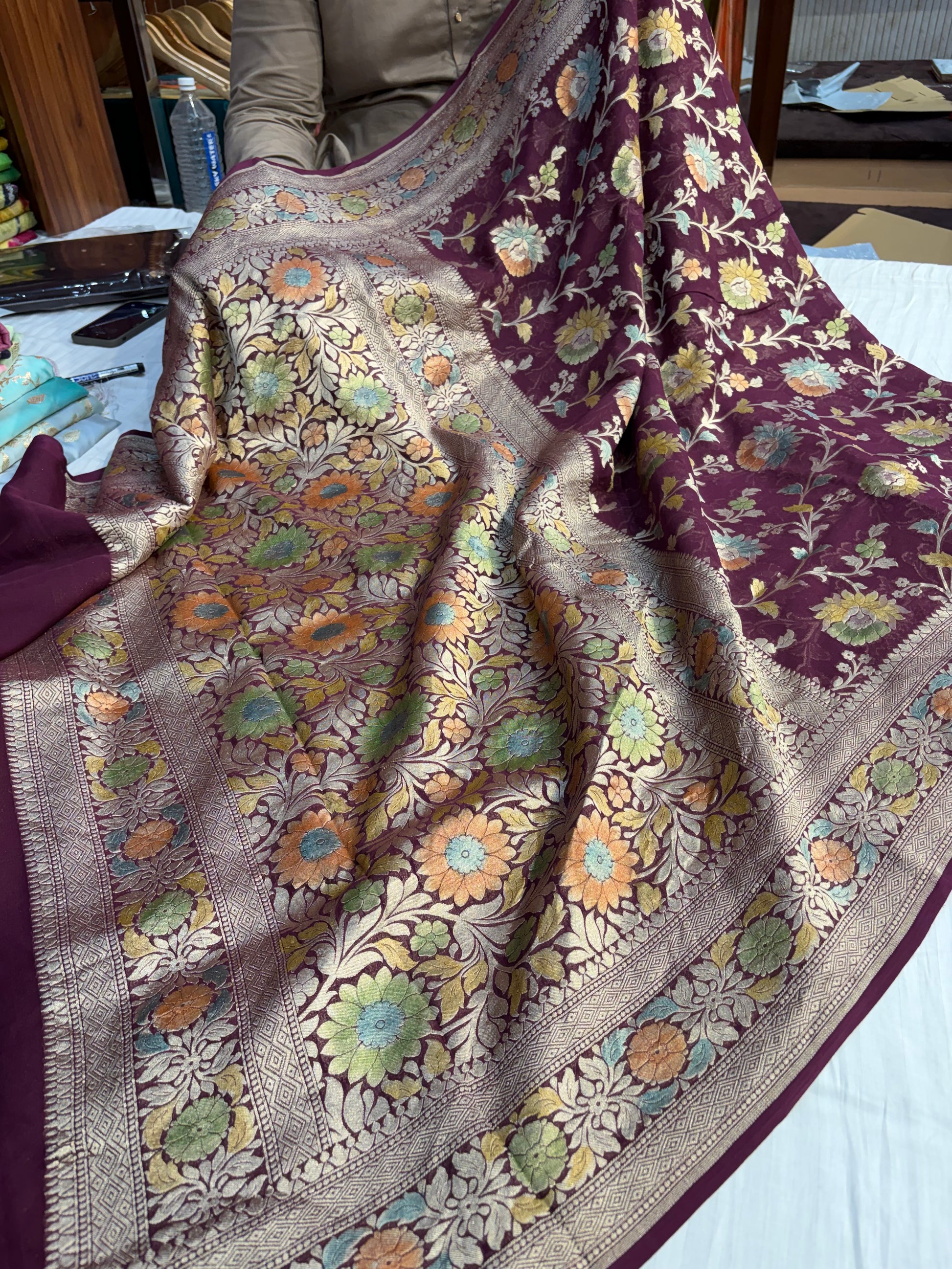 Pure Banarasi handloom georgette silk saree in wine colour with all over hand drawing work