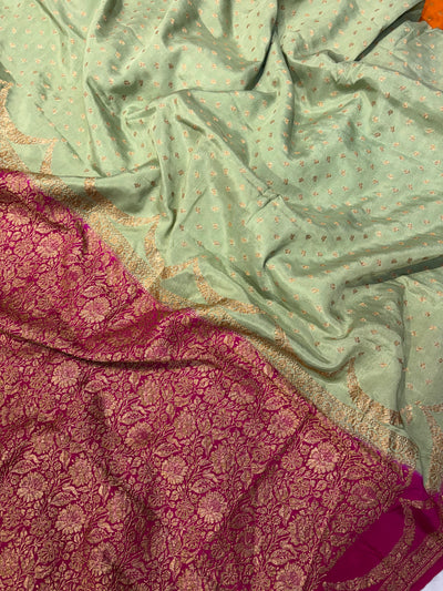 Pure khaddi crepe silk saree in pista green with Rani pink colour