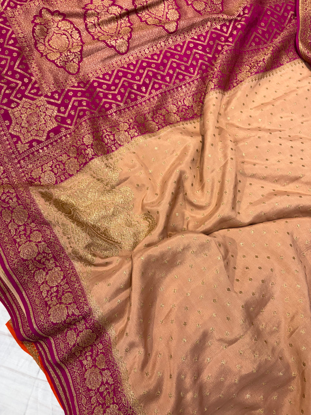 Pure khaddi crepe silk saree in Peach with rani pink colour