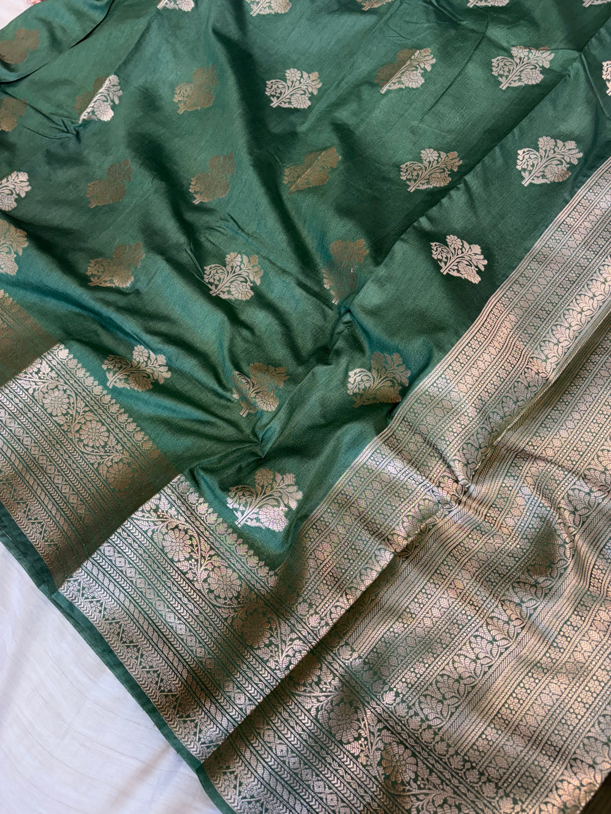 Banarasi soft katan silk saree in bottle green colour