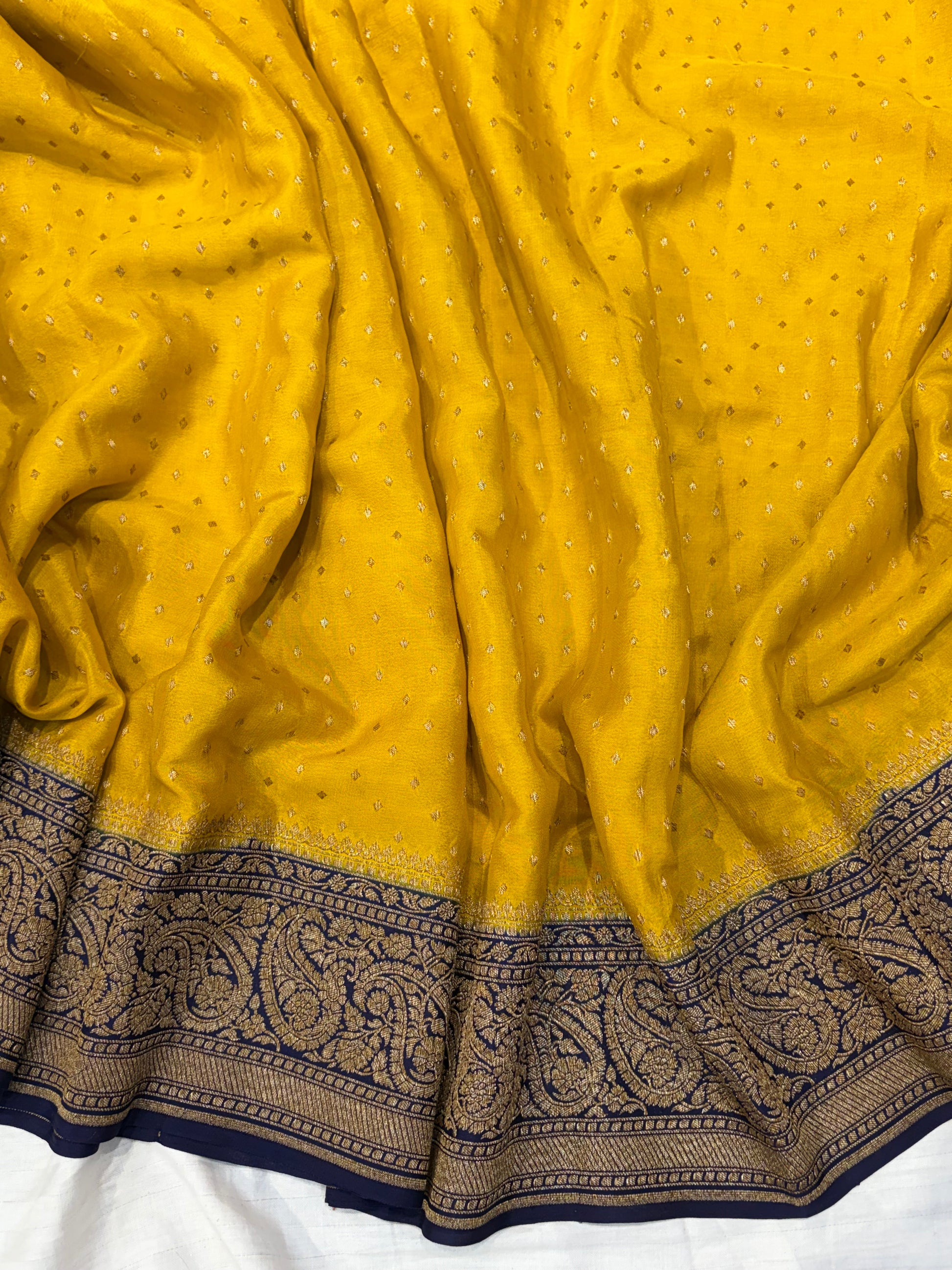 Pure khaddi crepe silk saree in mustard yellow with dark navy blue colour