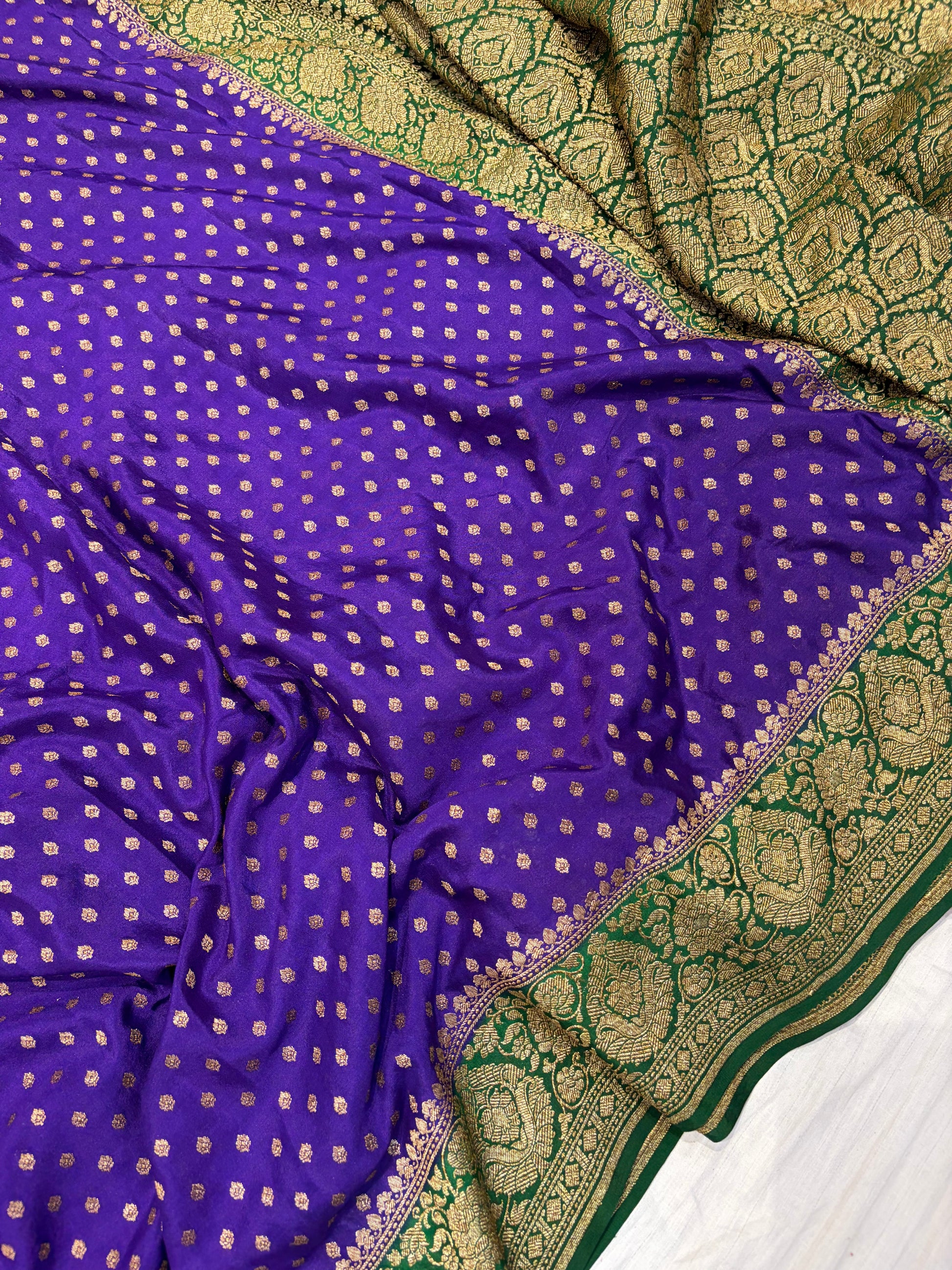 Pure khaddi crepe silk saree in purple with bottle green colour