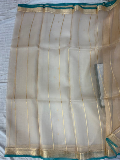 Pure handloom organza silk saree In off white colour with Rama green piping border