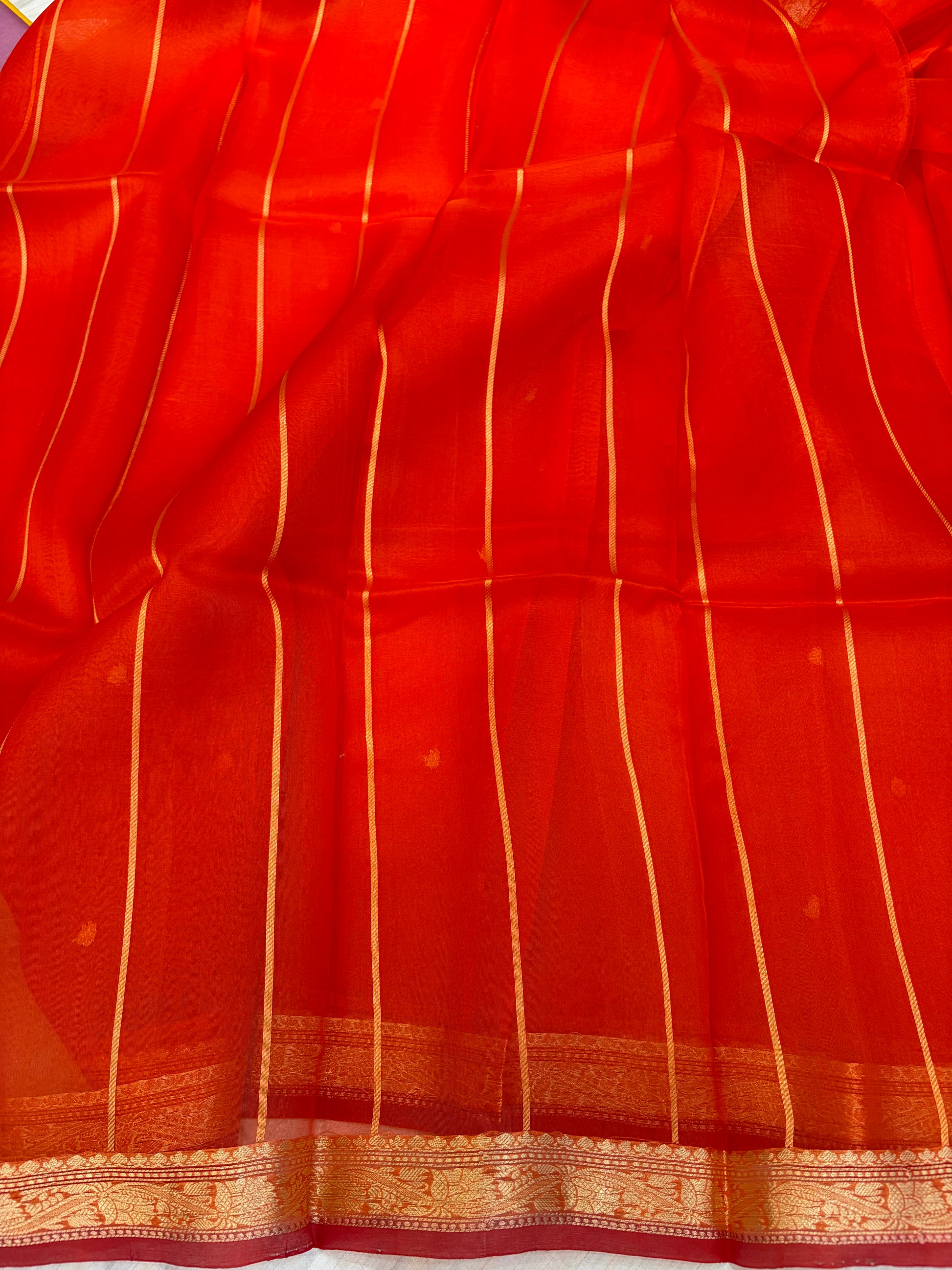 Pure handloom organza silk saree In orange colour with red piping border