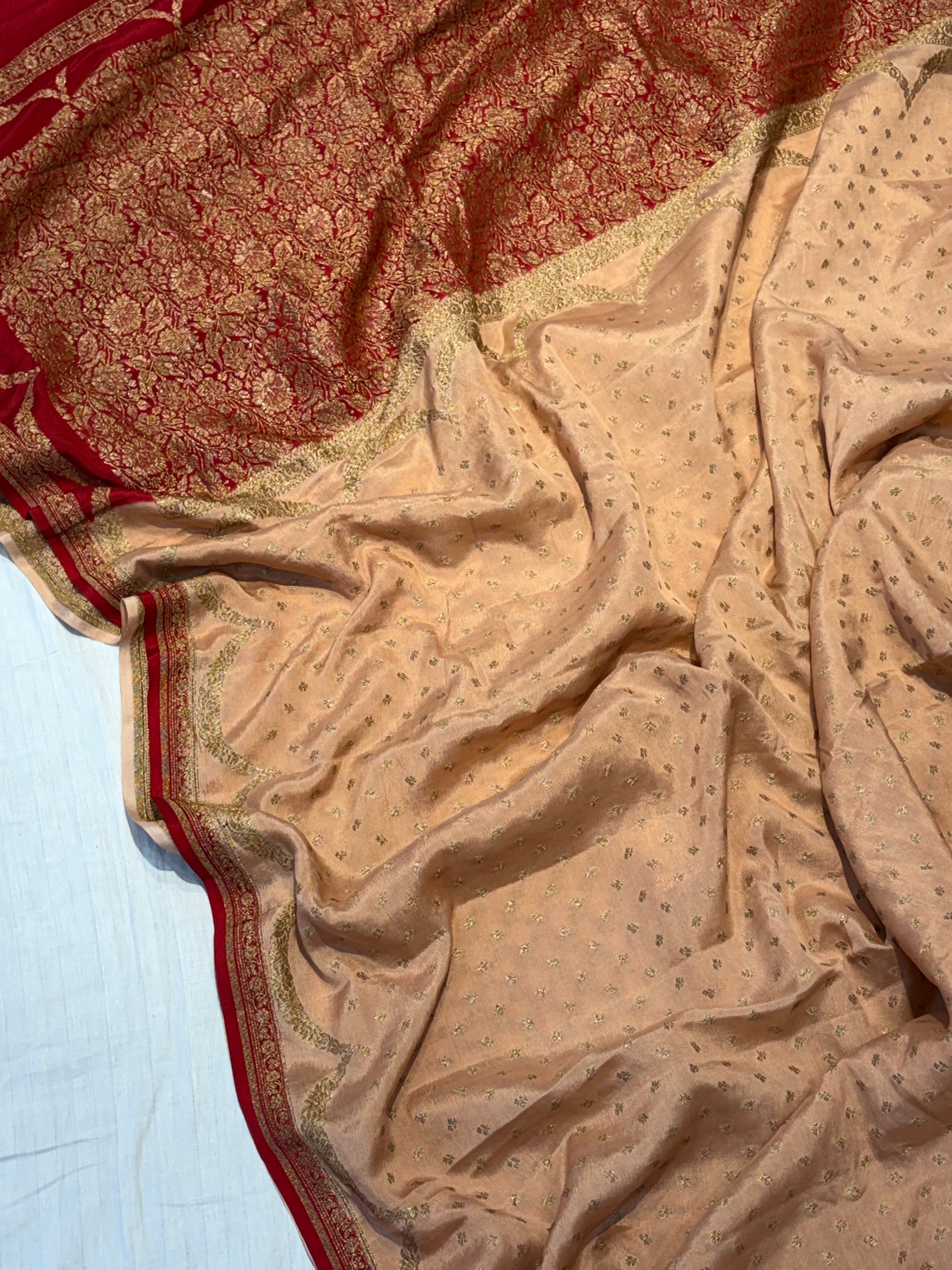 Pure khaddi crepe silk saree in Peach with Red colour