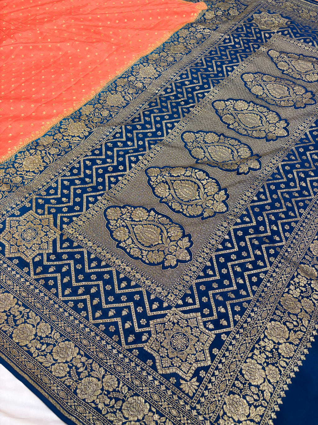 Pure khaddi crepe silk saree in peach & German blue colour