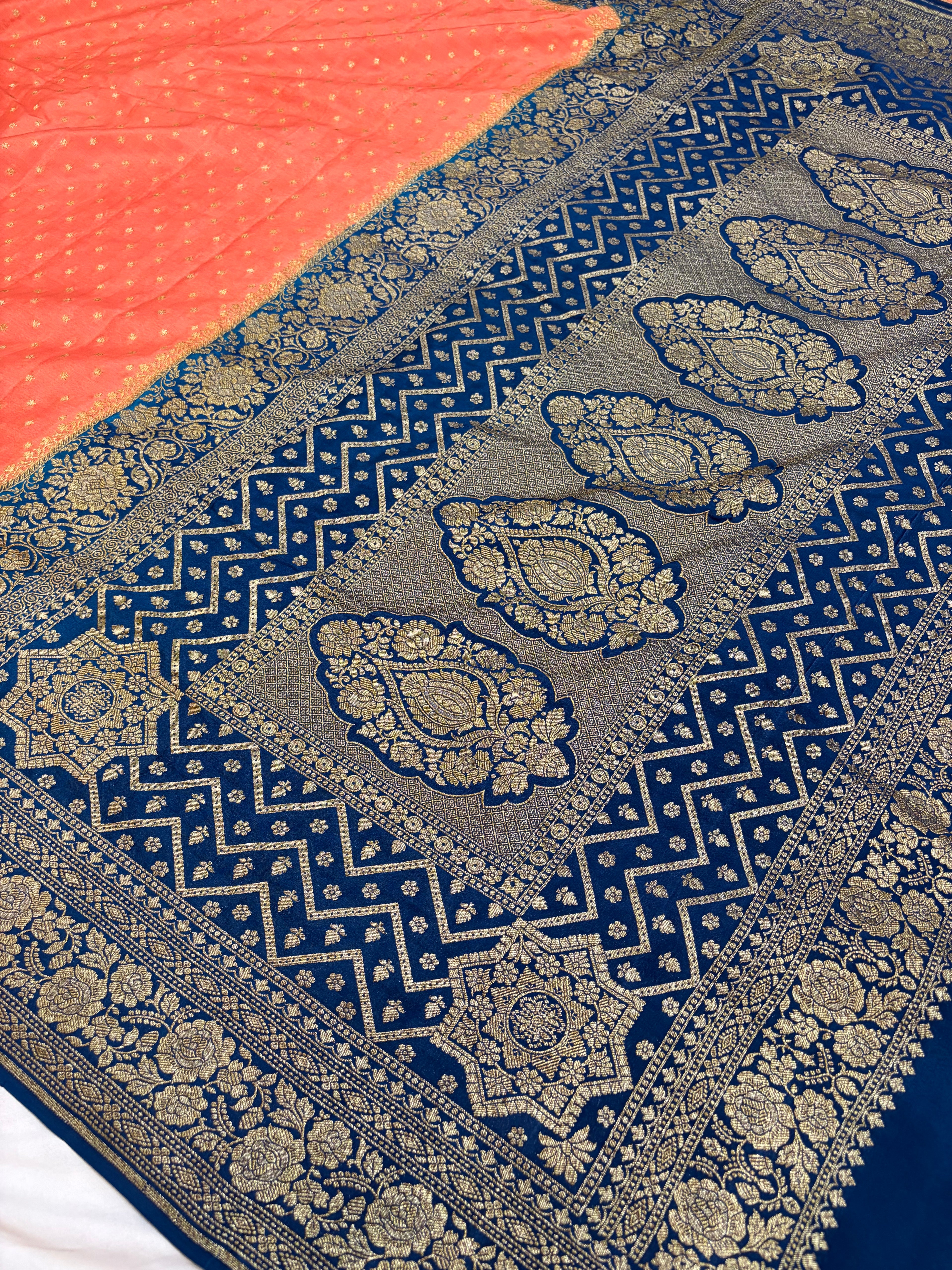 Pure khaddi crepe silk saree in peach & German blue colour