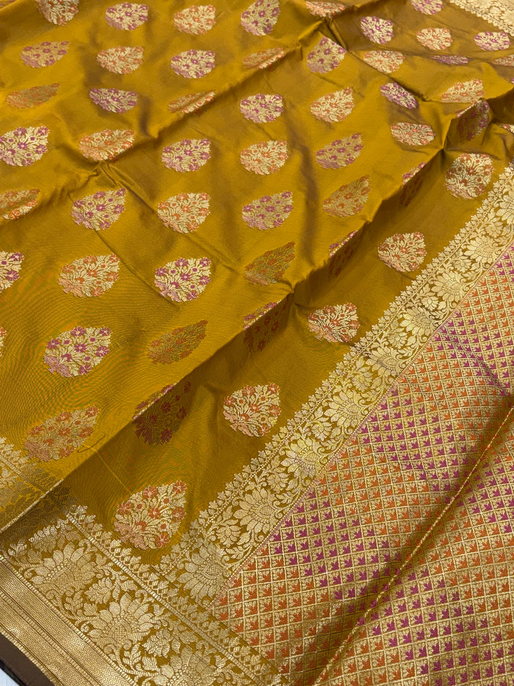 Banarasi katan by katan silk saree in mustard gold  colour with multiple meenakari work
