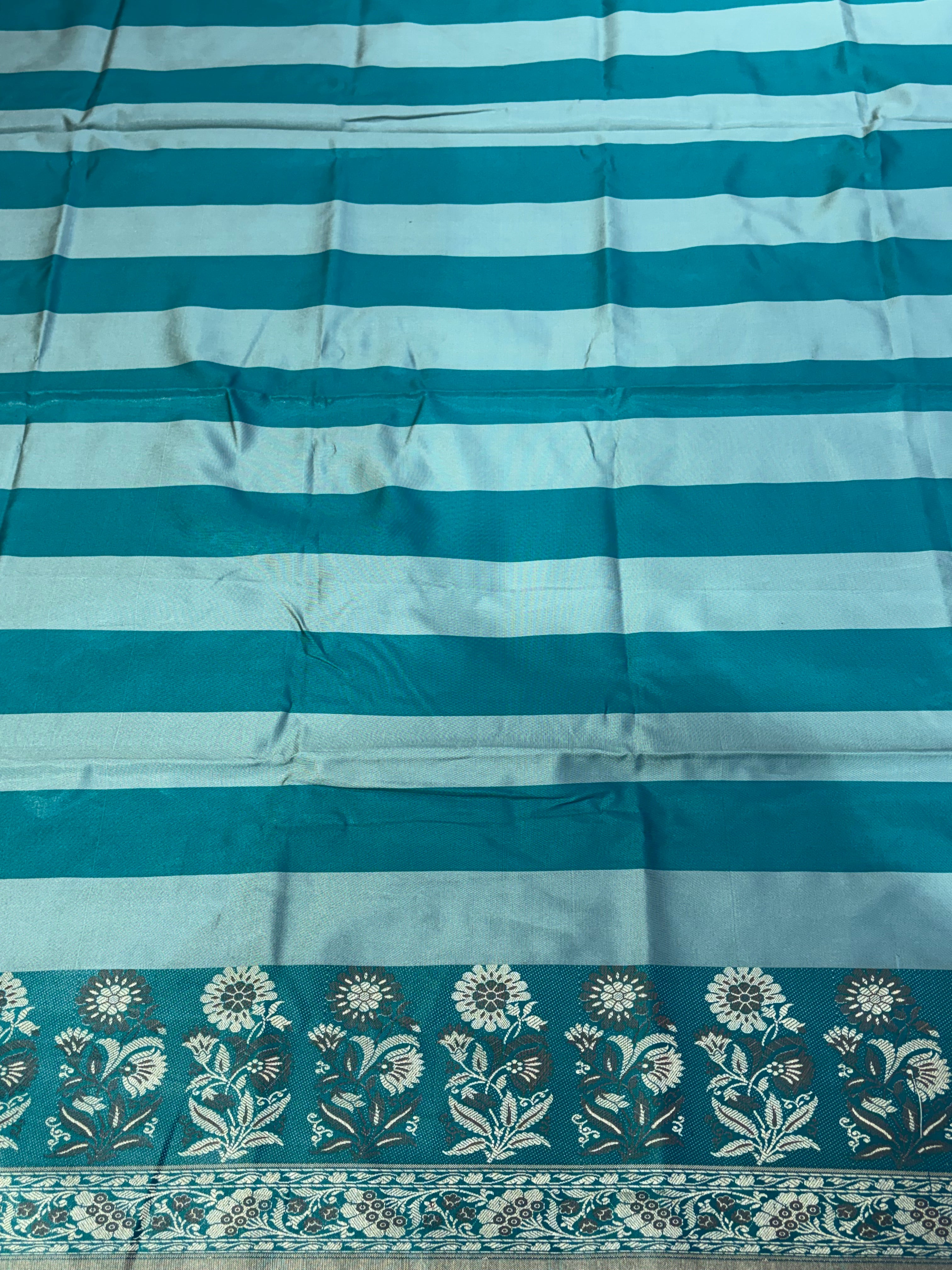 Banarasi soft silk suit in teal blue  with ice blue colour combination with tussels