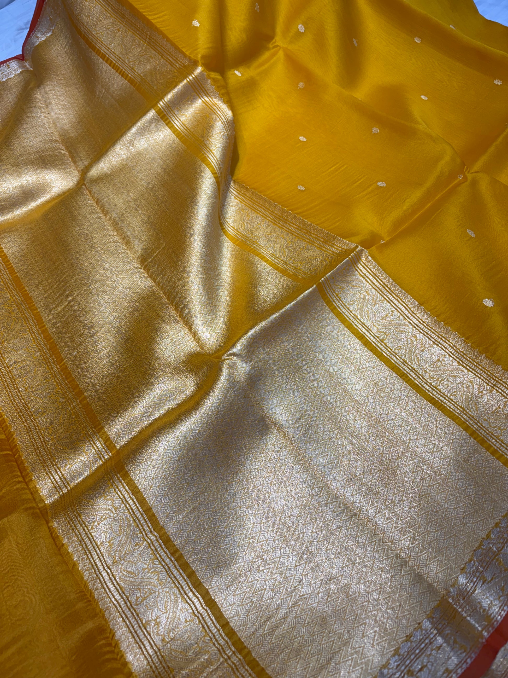 Pure handloom organza silk saree In Mustard yellow colour with rust orange piping border