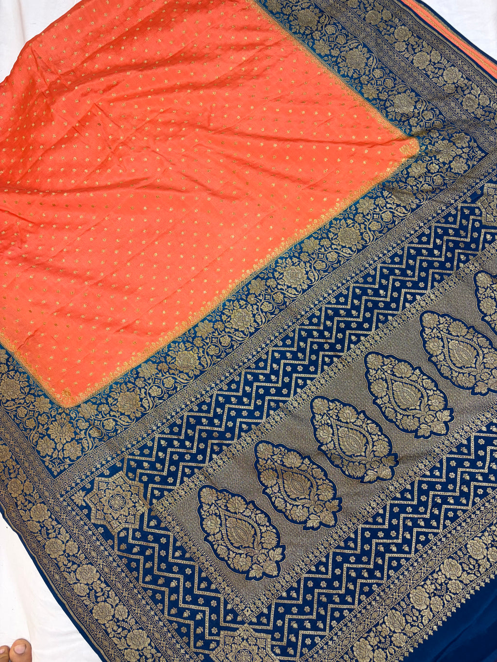 Pure khaddi crepe silk saree in peach & German blue colour