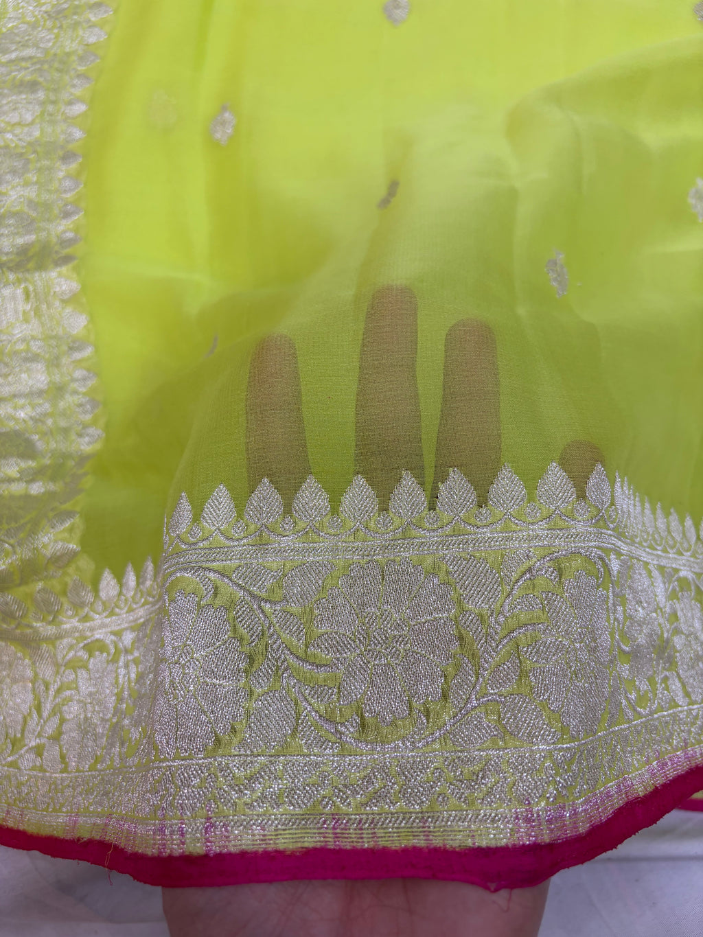 Pure khaddi chiffon saree in neon green colour with Rani pink piping border