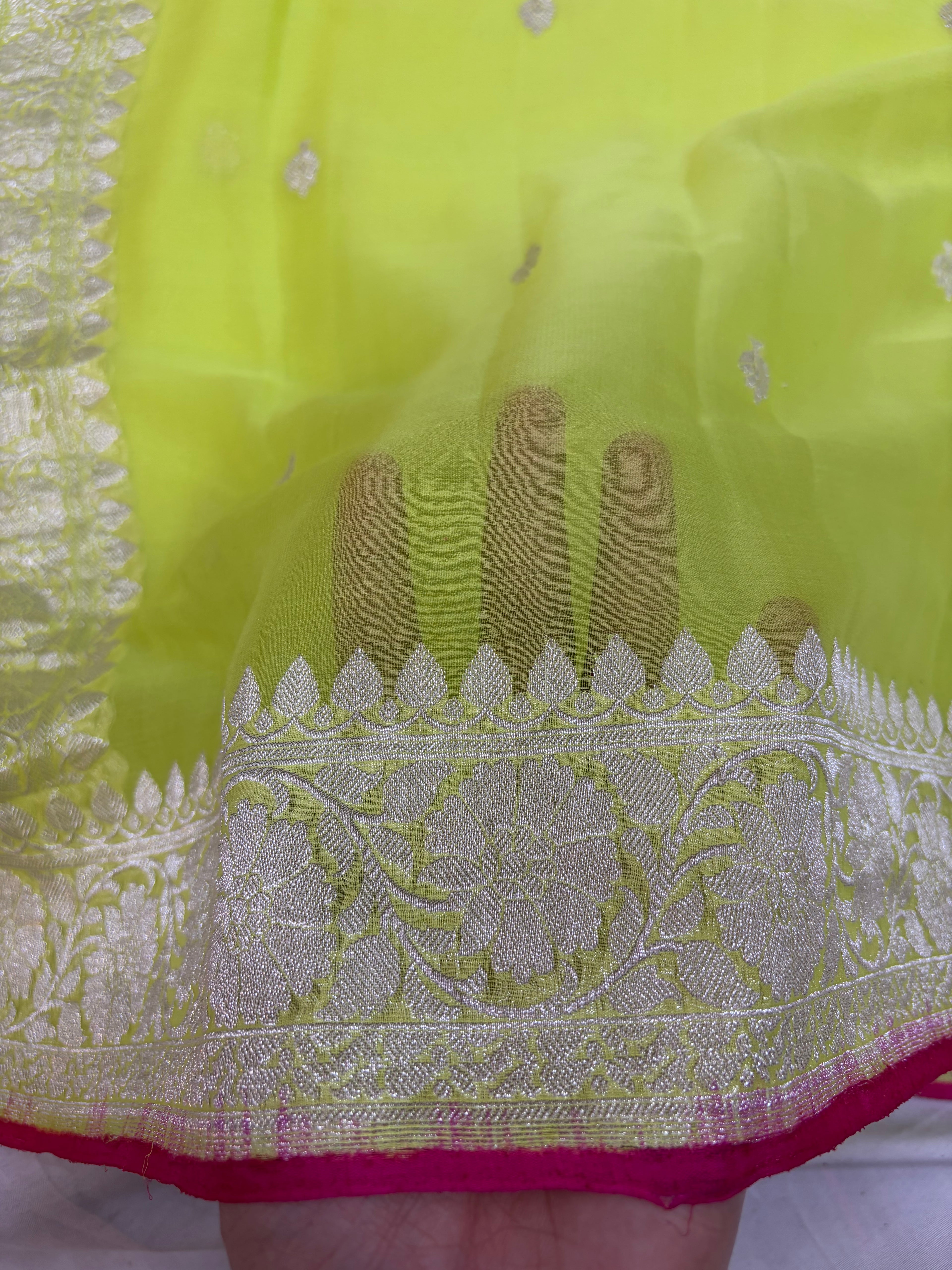 Pure khaddi chiffon saree in neon green colour with Rani pink piping border