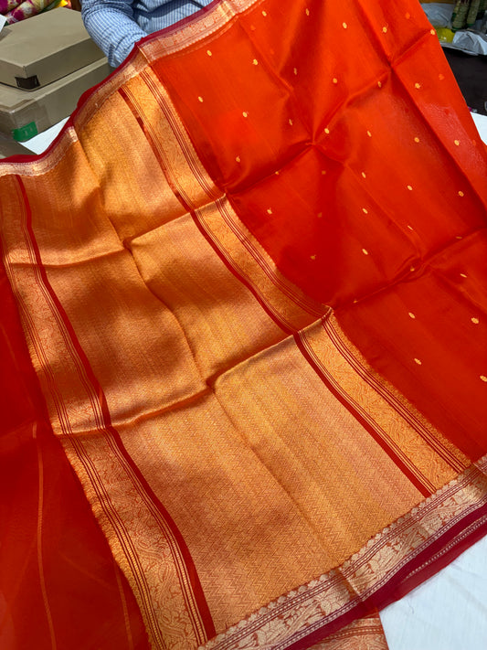 Pure handloom organza silk saree In orange colour with red piping border