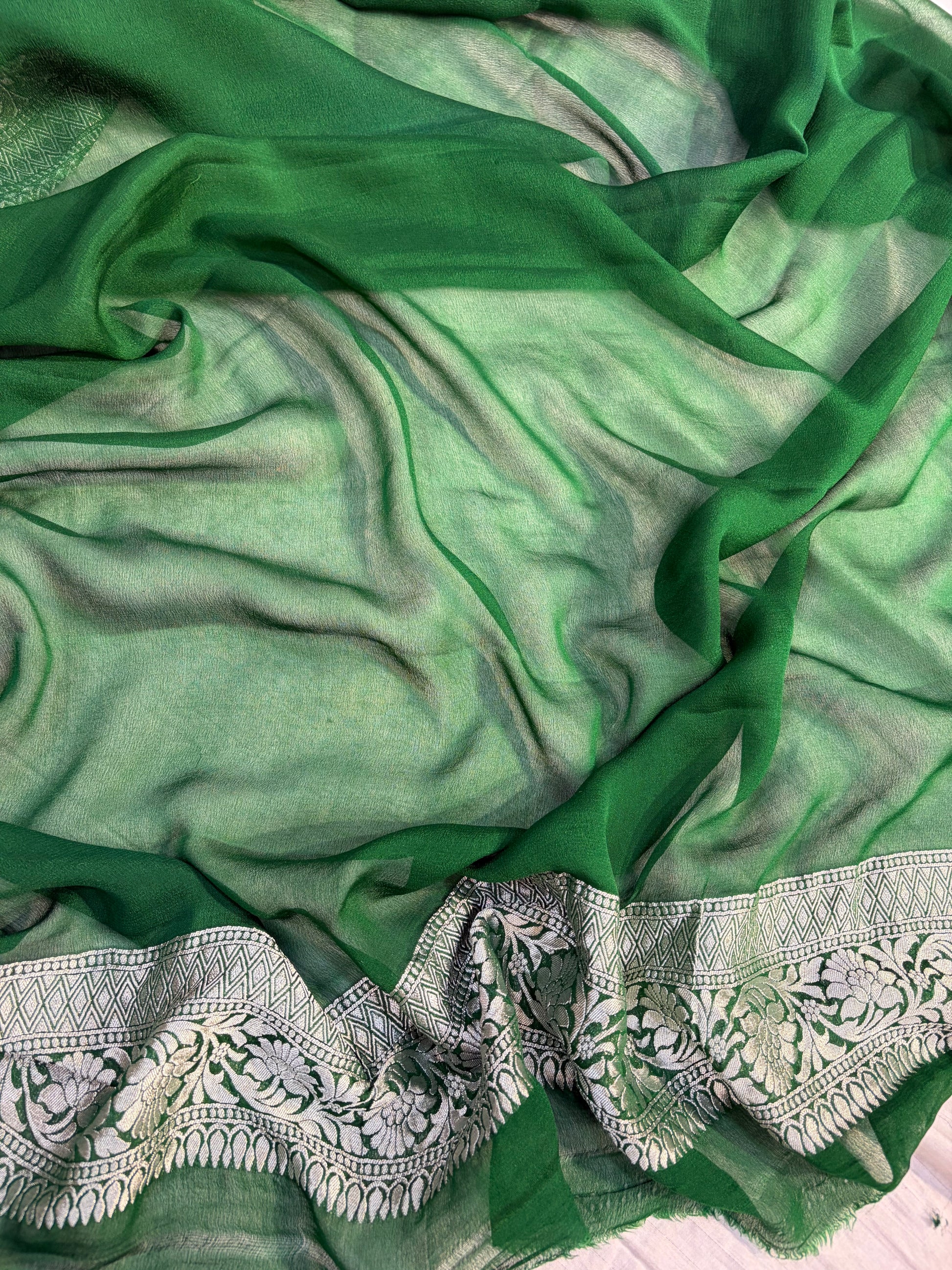 Pure georgette silk saree in temple design in a beautiful combination of Rani with bottle green colour