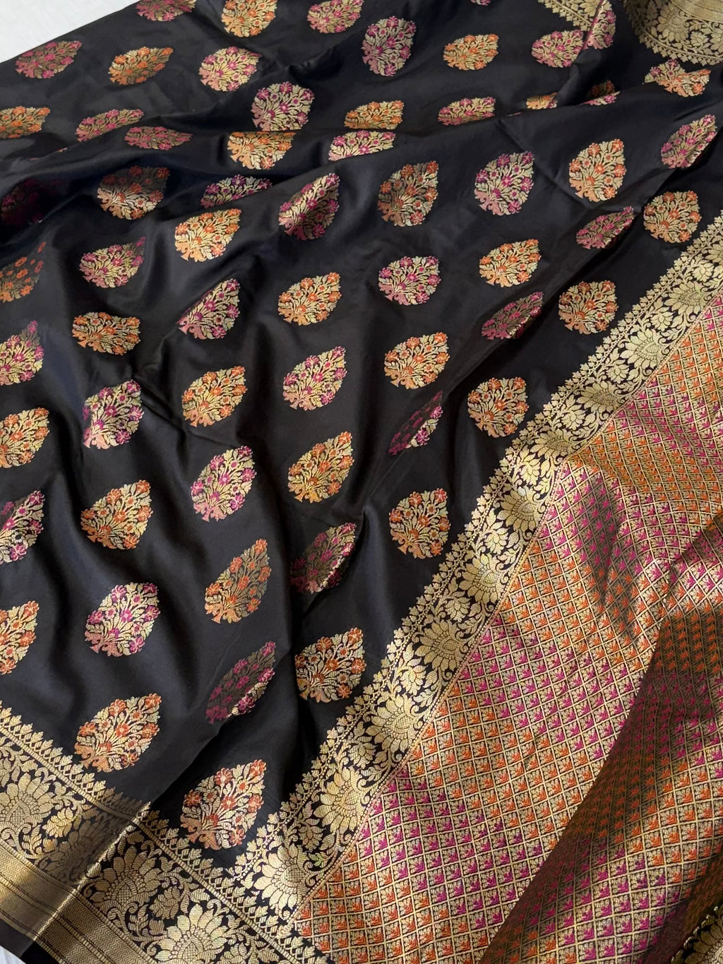 Banarasi katan by katan silk saree in black colour with multiple meenakari work
