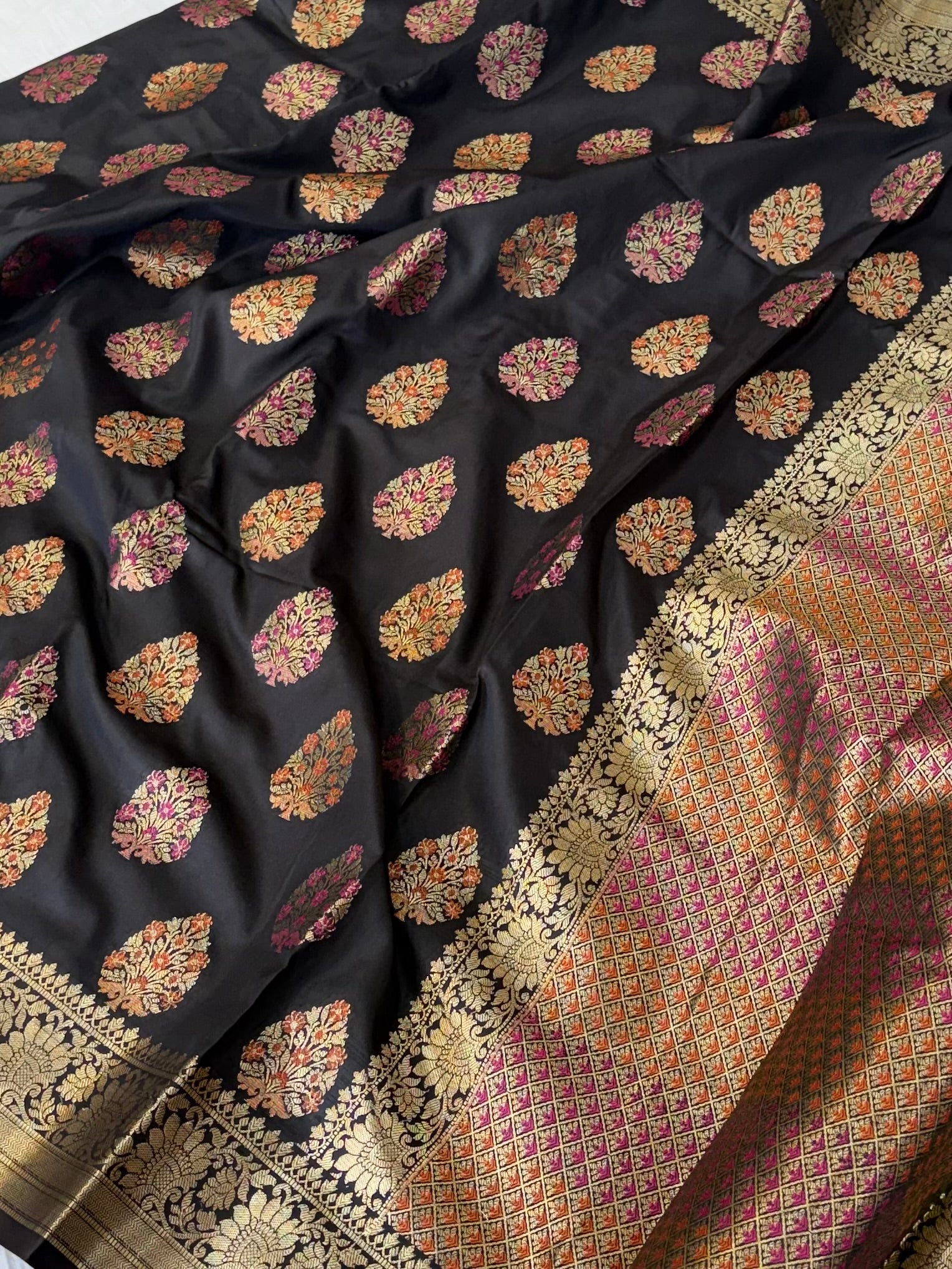 Banarasi katan by katan silk saree in black colour with multiple meenakari work