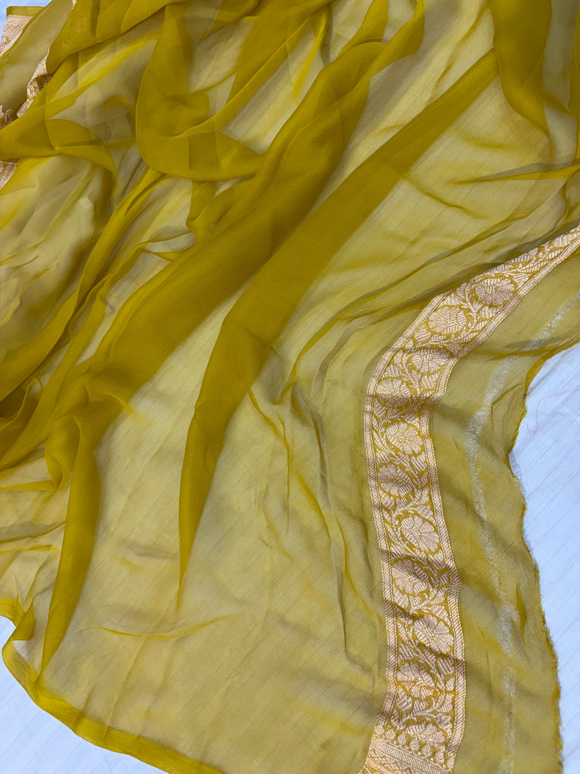 Pure khaddi chiffon saree with gold zari work in off white with olive yellow colour