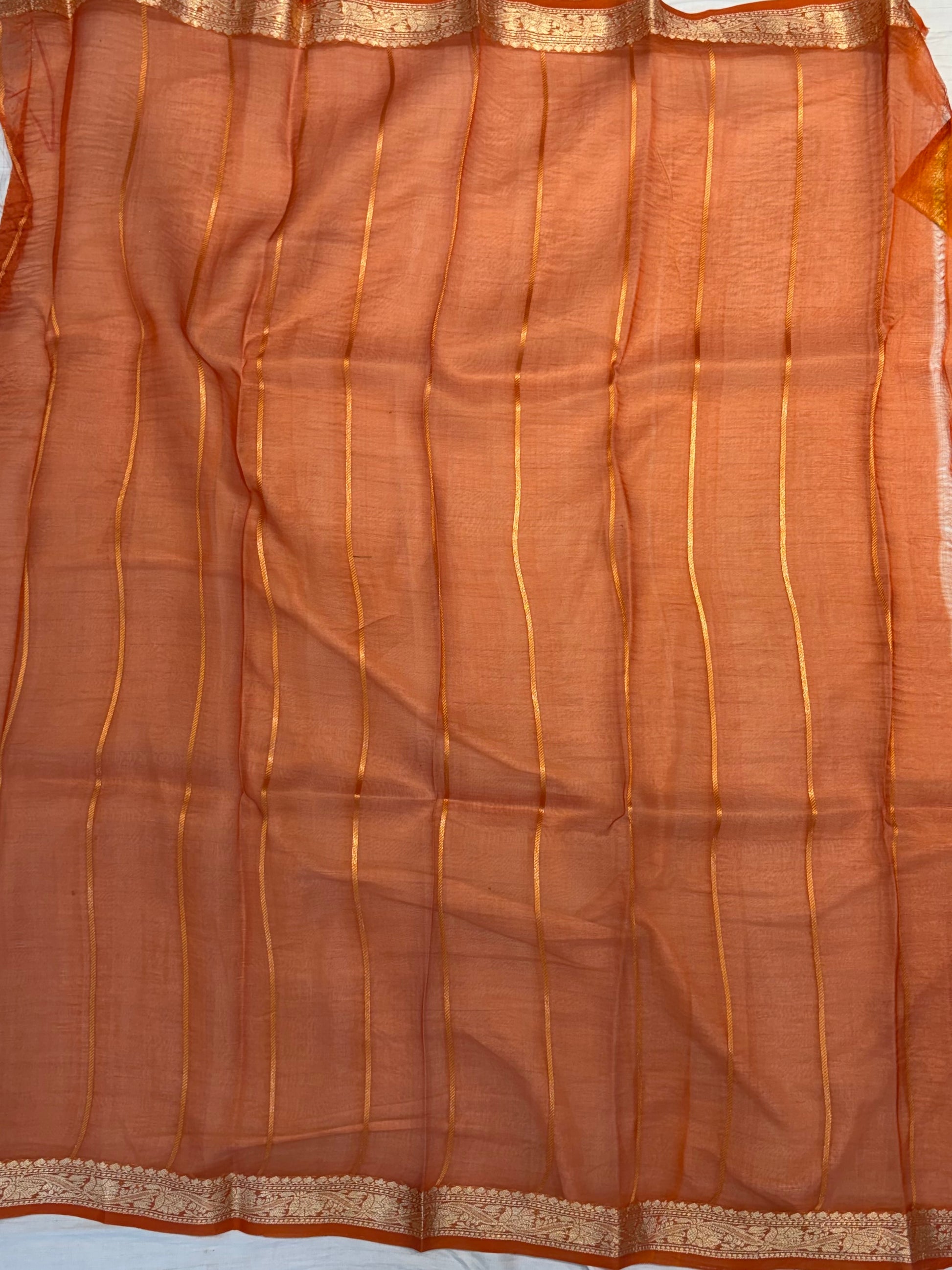 Pure handloom organza silk saree In Mustard yellow colour with rust orange piping border