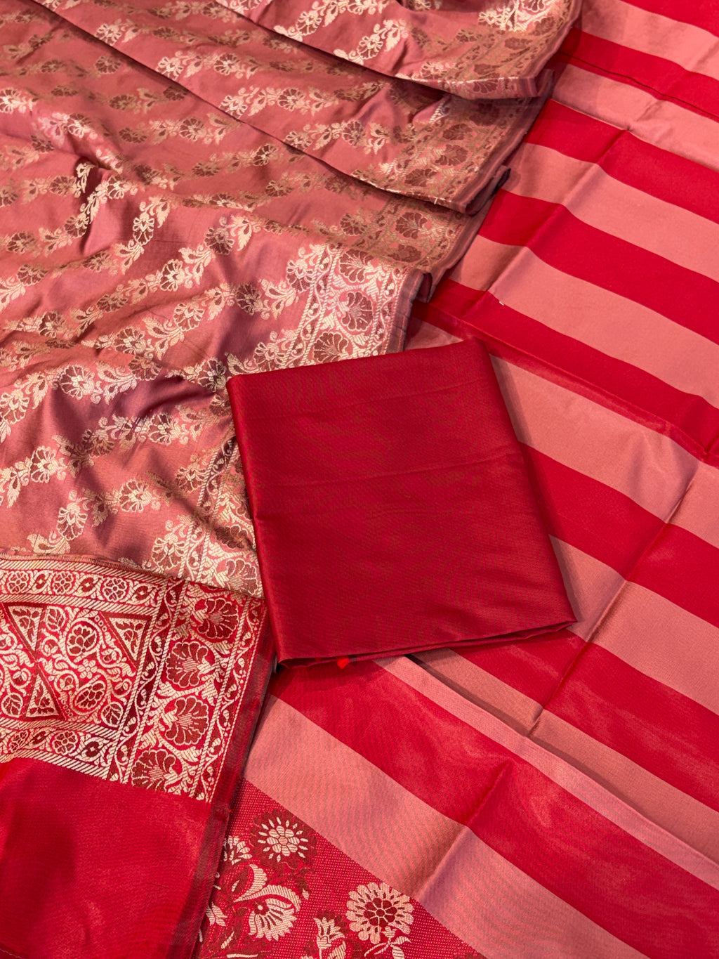 Banarasi soft silk suit in red with dusty rose colour combination with tussels