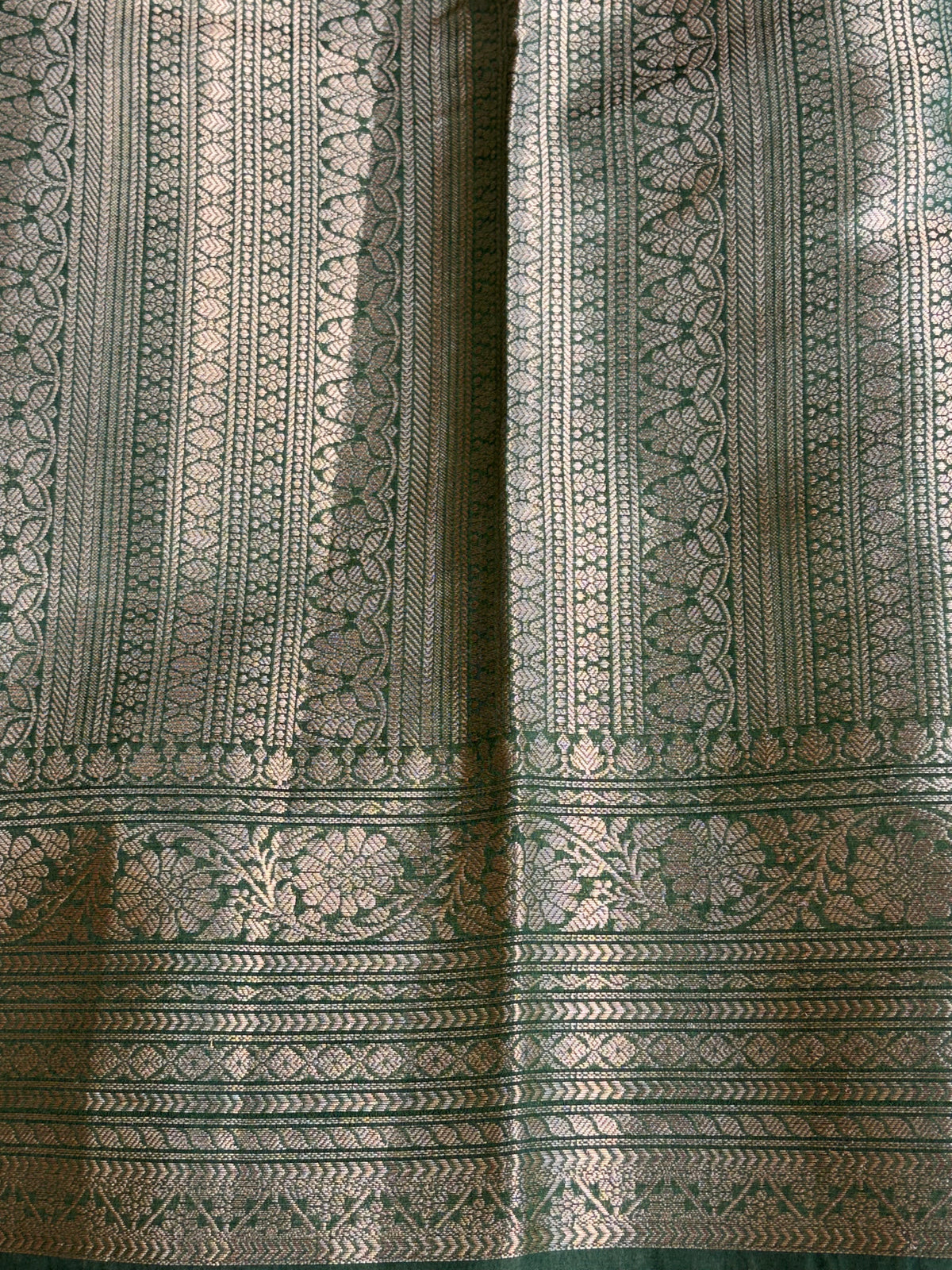 Banarasi soft katan silk saree in bottle green colour