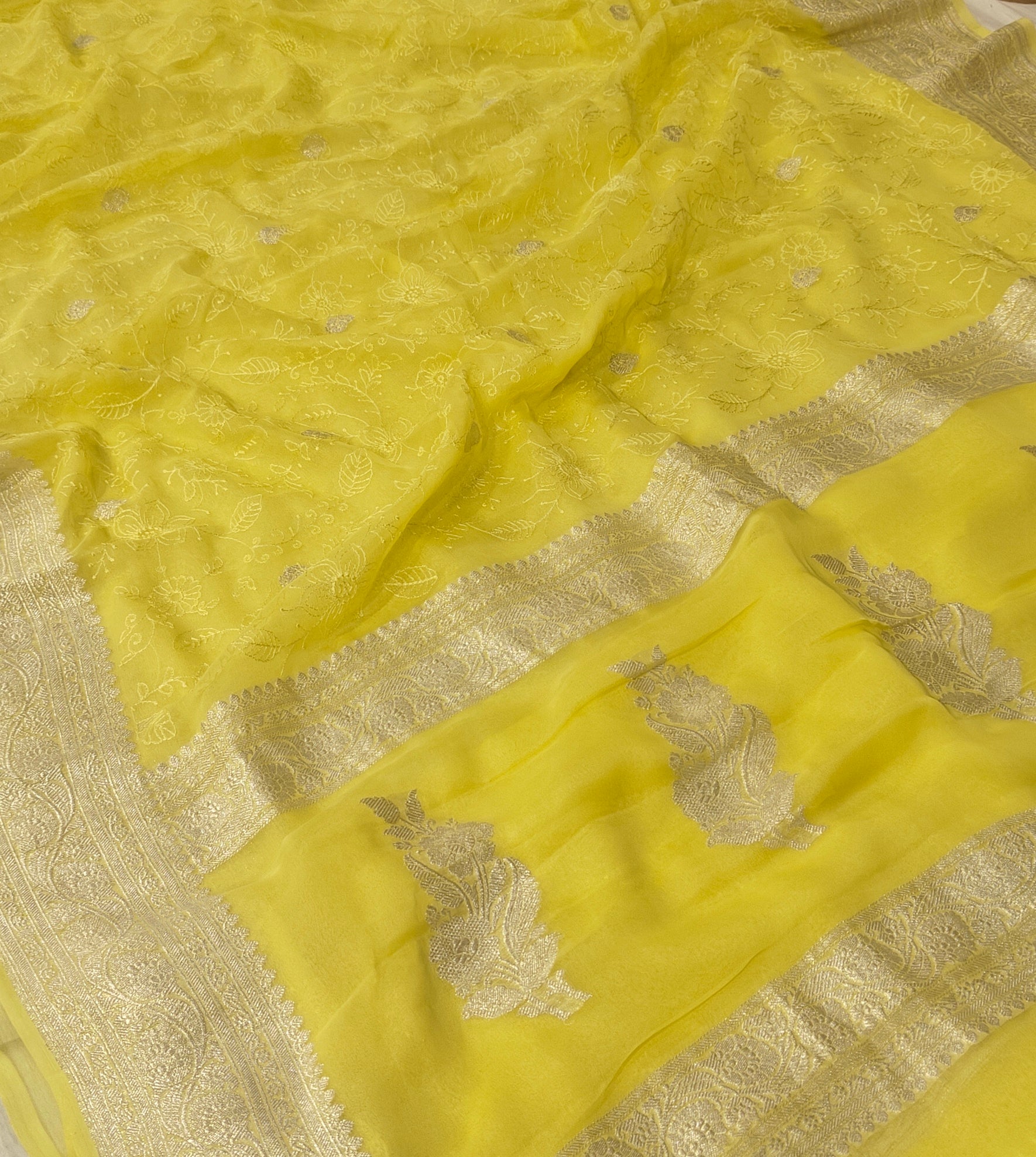 Pure khaddi chiffon saree in lemon yellow colour with all over chickenkari work