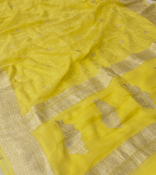 Pure khaddi chiffon saree in lemon yellow colour with all over chickenkari work