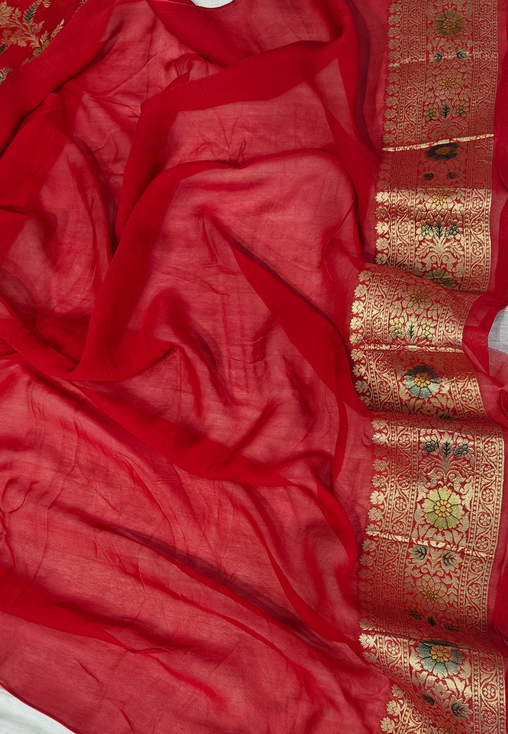 Red colour jaal georgette silk Banarasi saree with multiple meenakari work