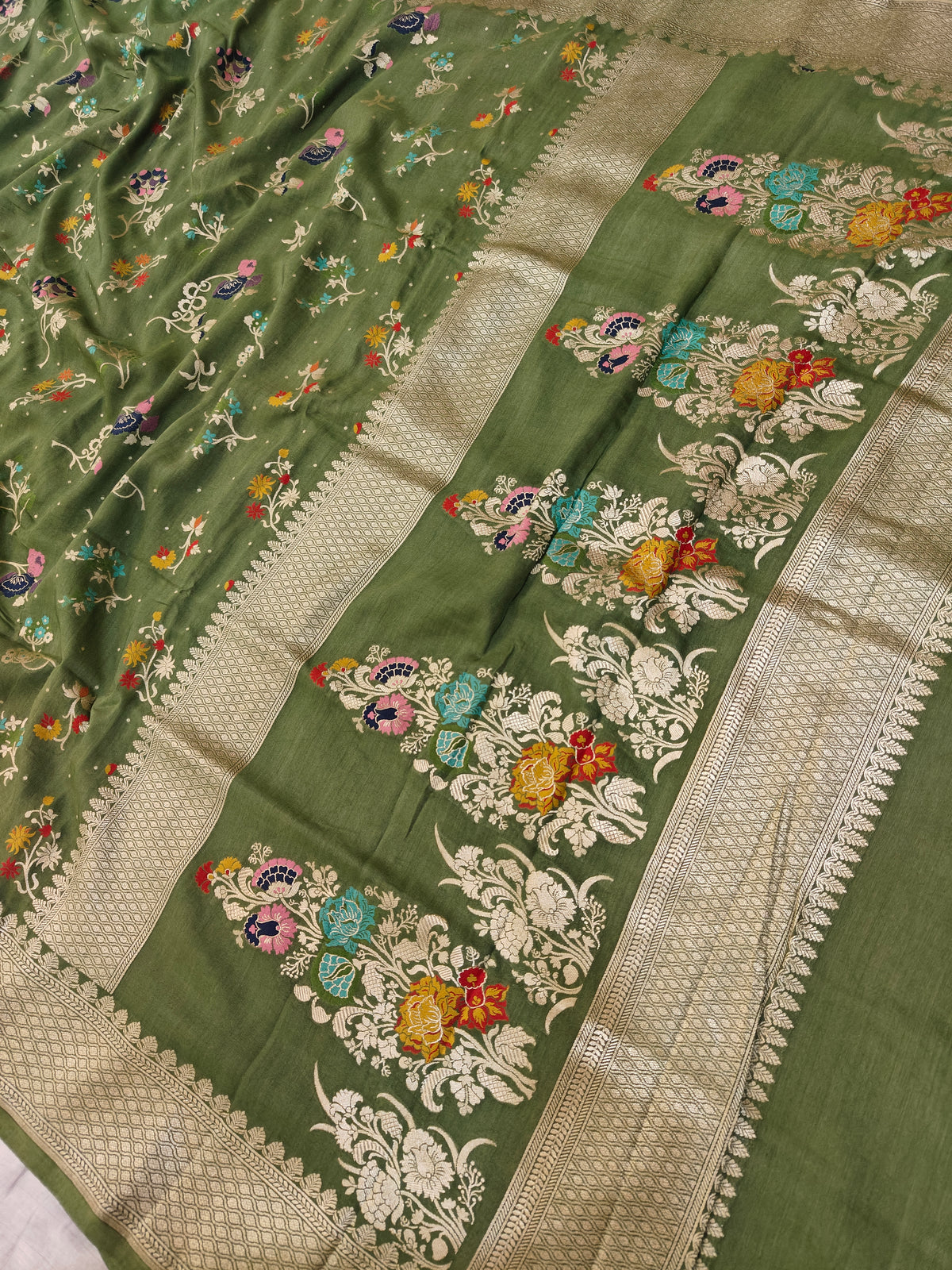 Premium Pure moonga banarasi saree in green colour with multiple meenakari work