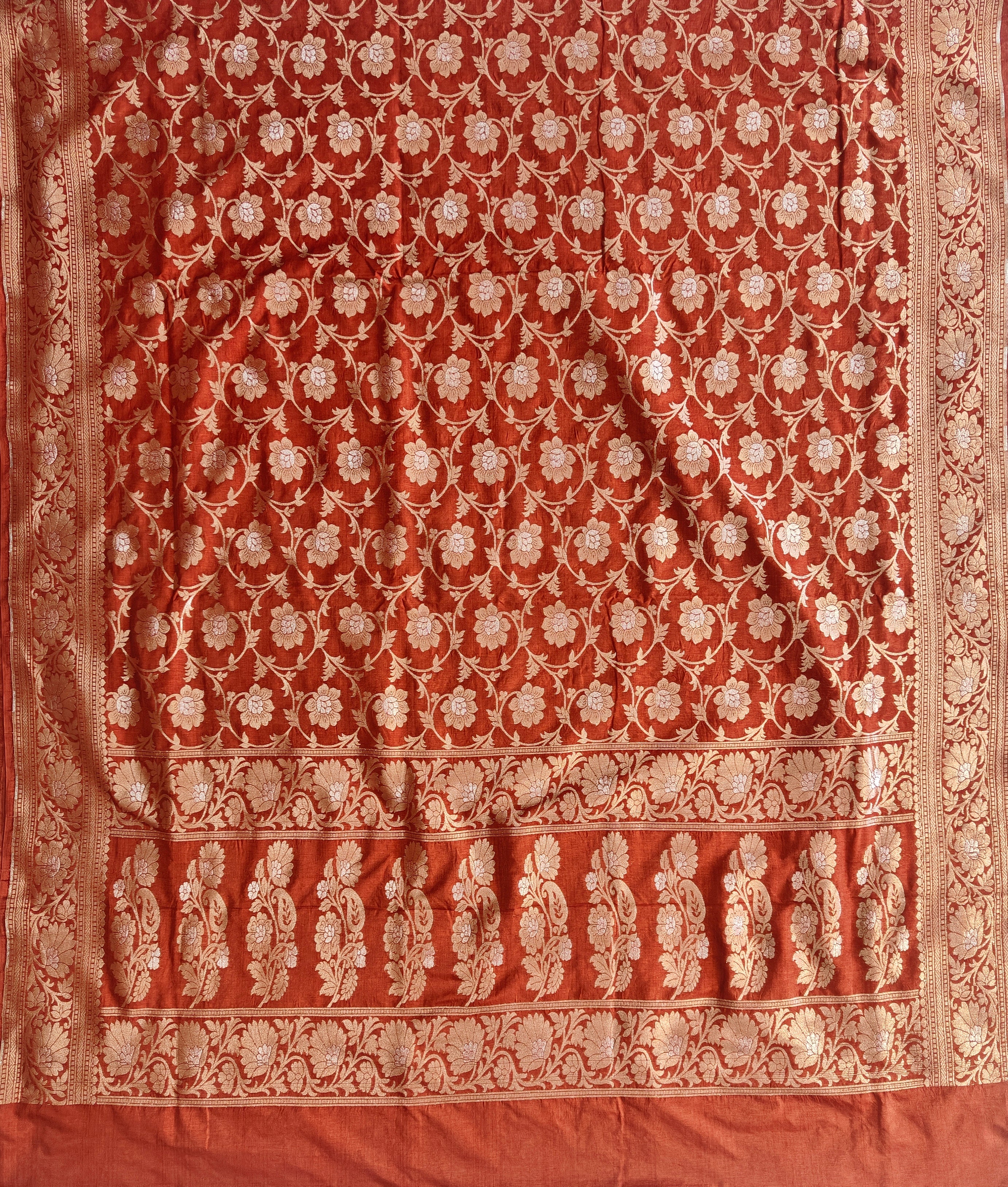 Banarasi georgette silk saree in rust orange colour with sonarupa detailing