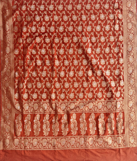Banarasi georgette silk saree in rust orange colour with sonarupa detailing