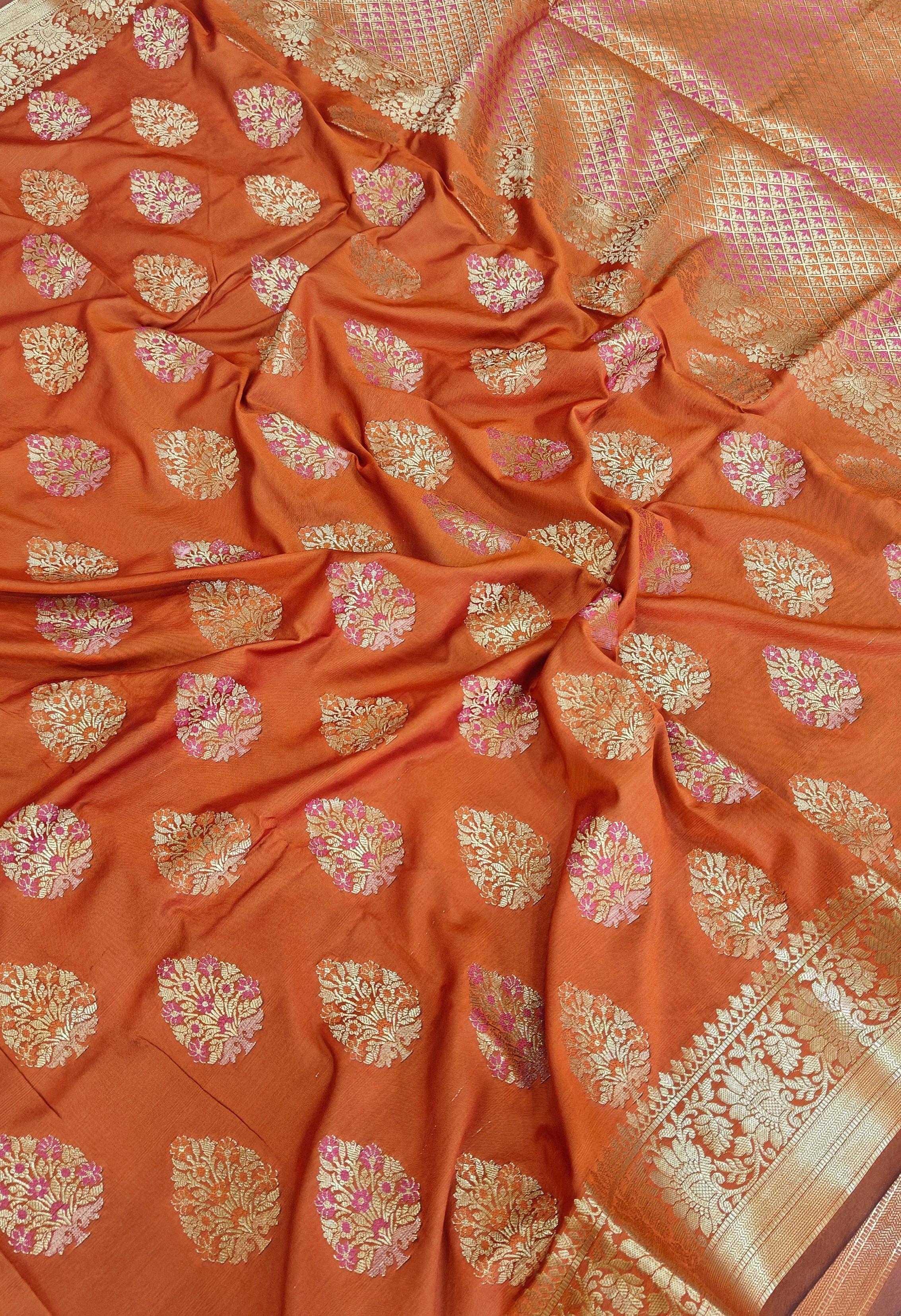 Banarasi katan by katan silk saree in orange colour with multiple meenakari work
