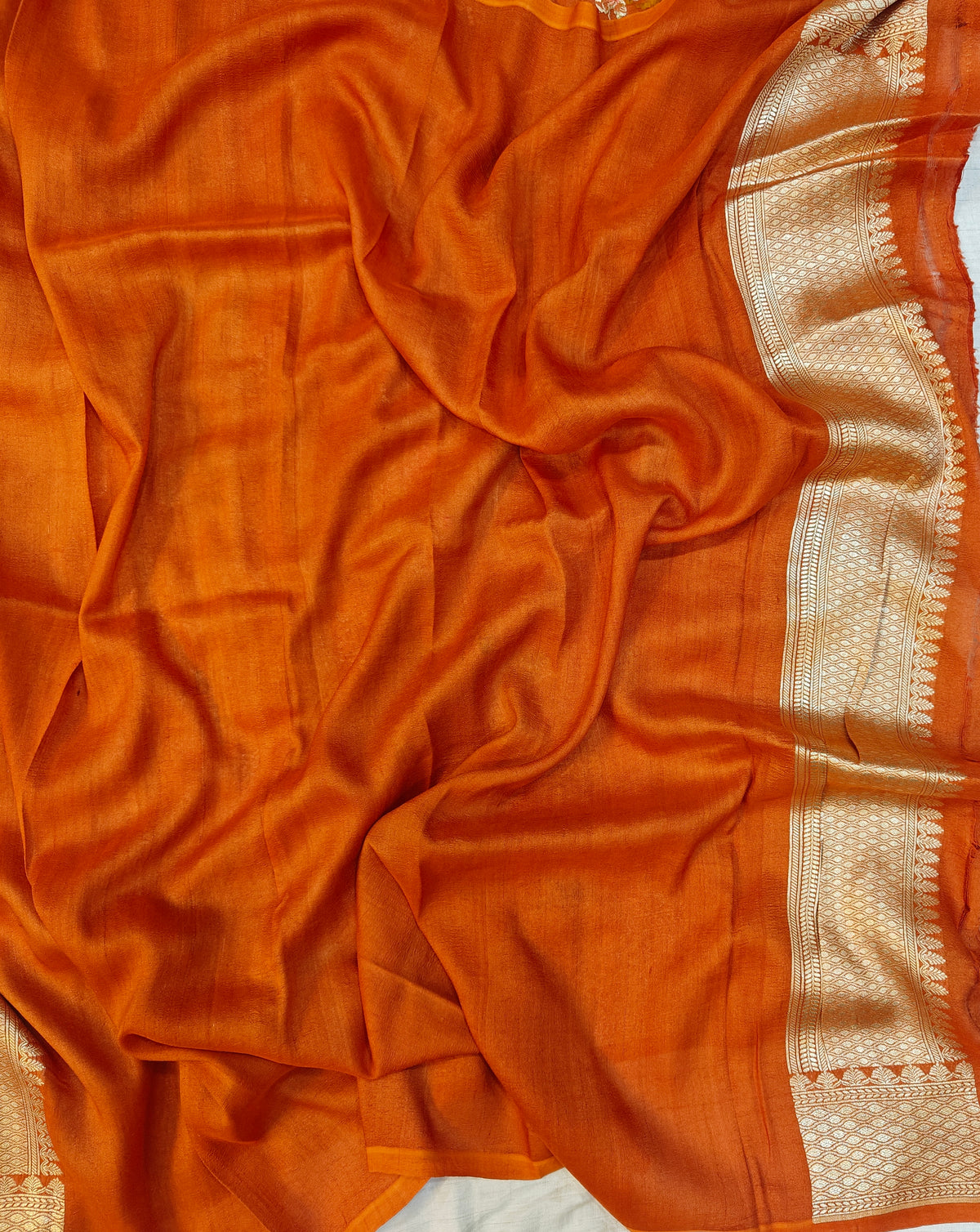 Premium pure georgette banarasi saree in rust orange colour with multiple meenakari work