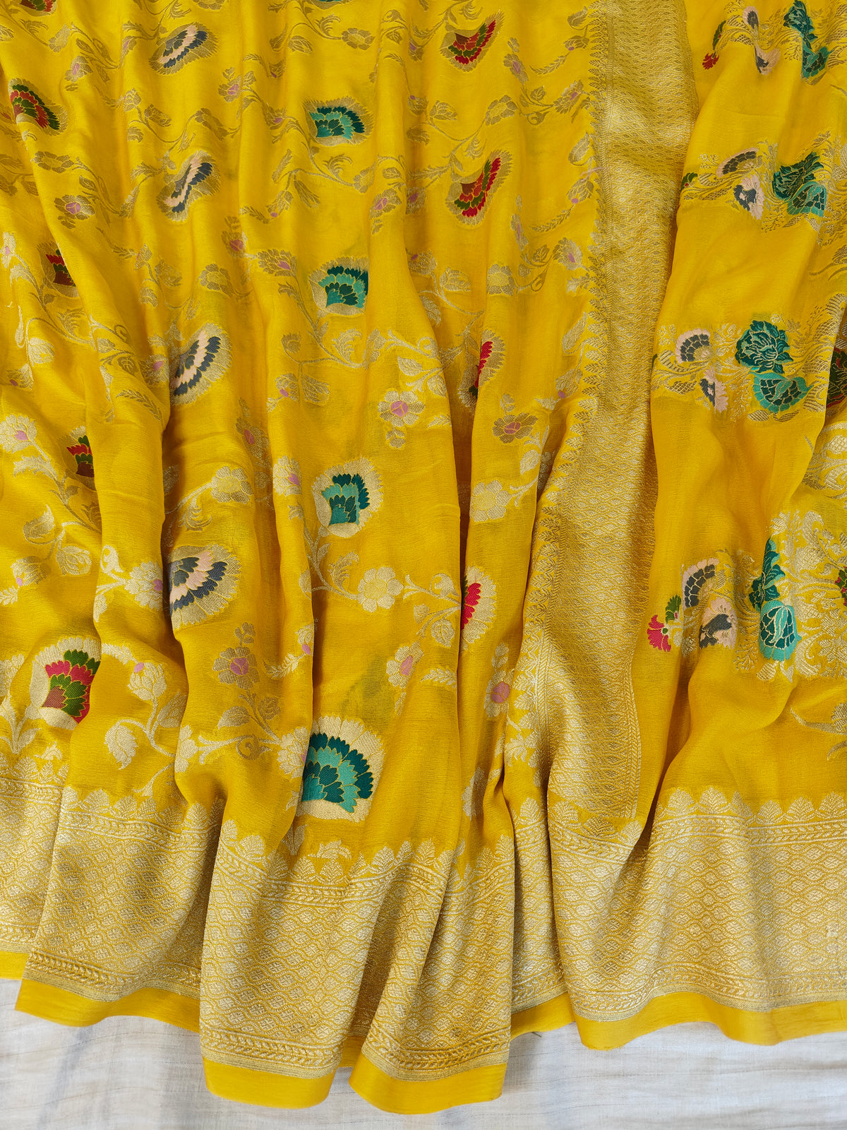 Premium pure georgette banarasi saree in yellow colour with multiple meenakari work