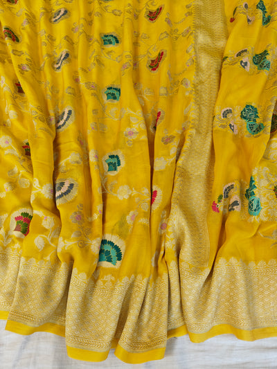 Premium pure georgette banarasi saree in yellow colour with multiple meenakari work