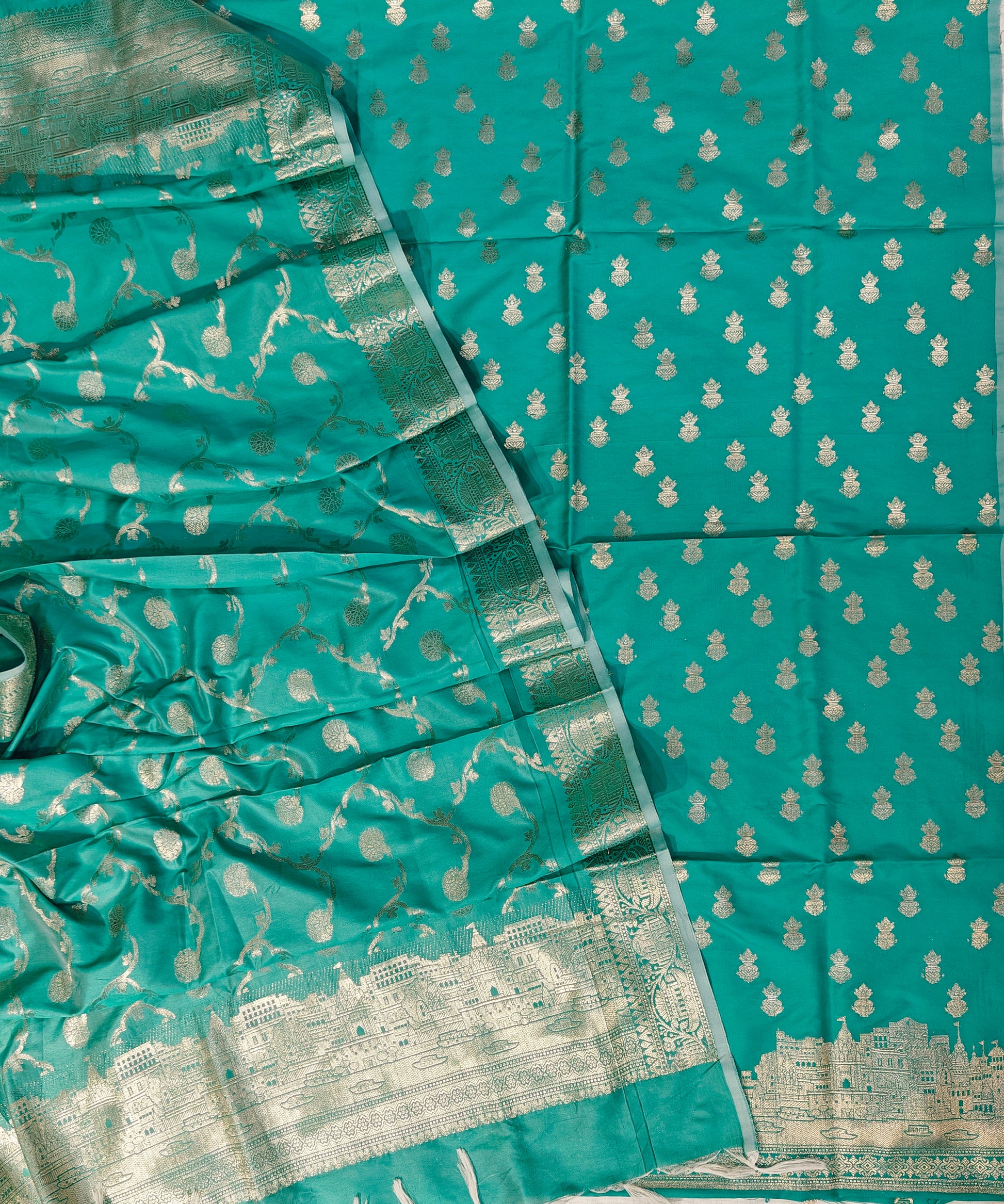 Banarasi soft silk suit in rama colour with temple design work