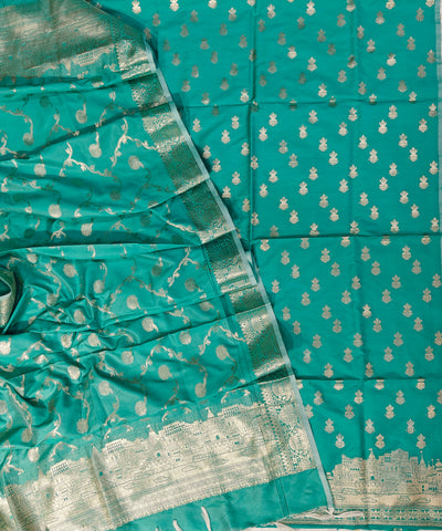 Banarasi soft silk suit in rama colour with temple design work