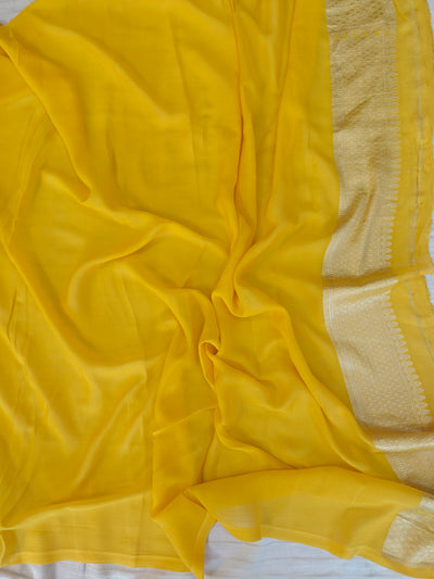 Premium pure georgette banarasi saree in yellow colour with multiple meenakari work