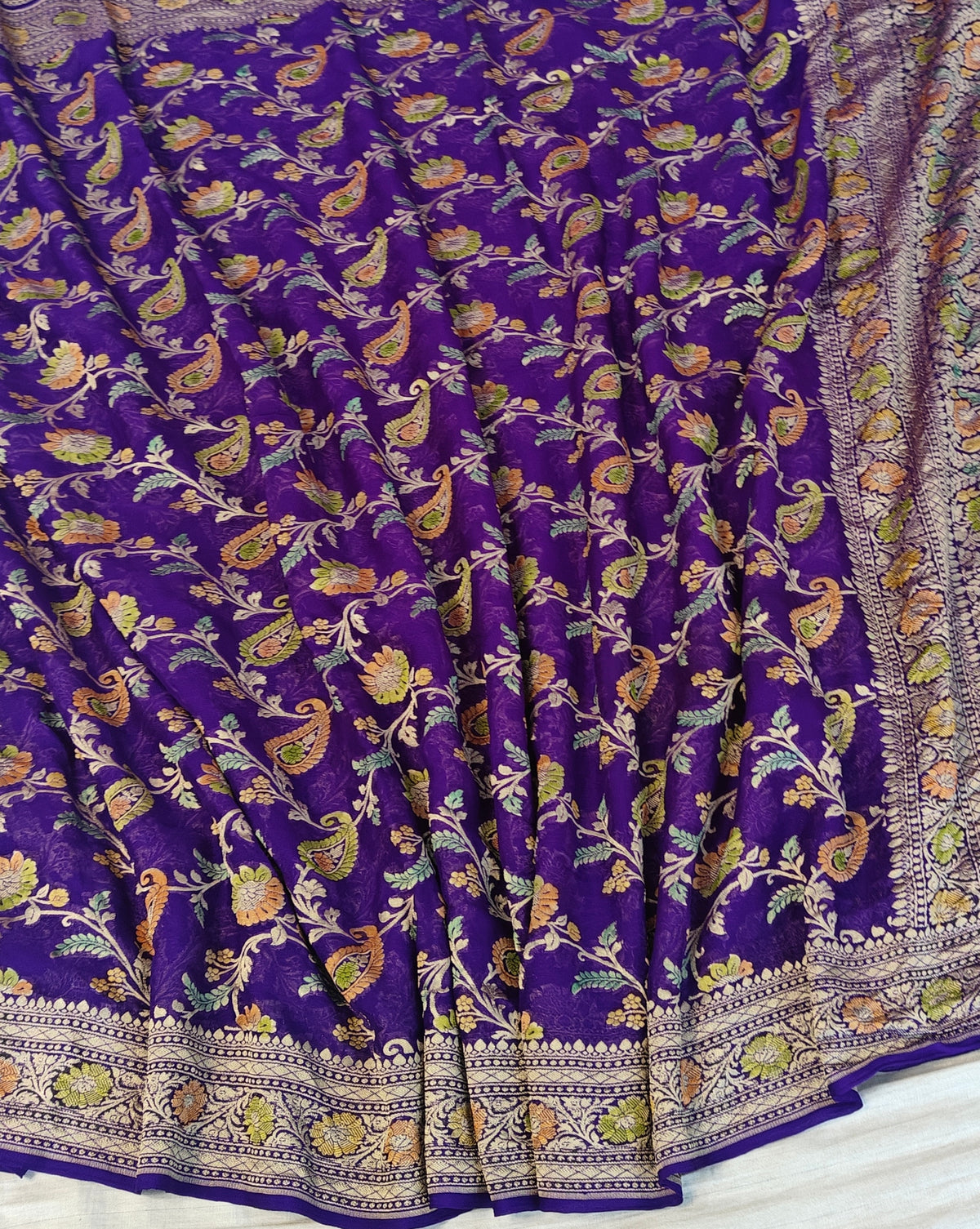 Pure georgette banarasi saree in purple colour with handbrush paint work