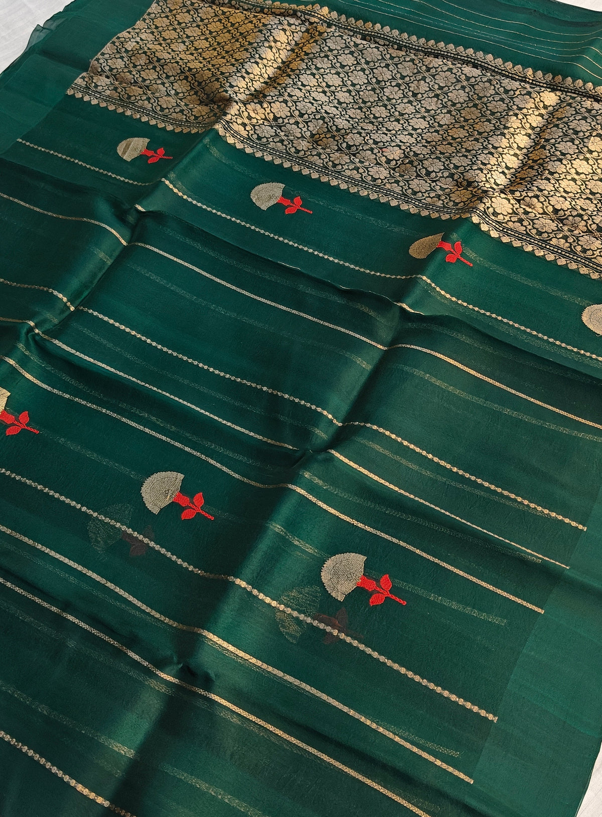 Pure handloom kora silk saree in stripes design with meenakari work in bottle green colour