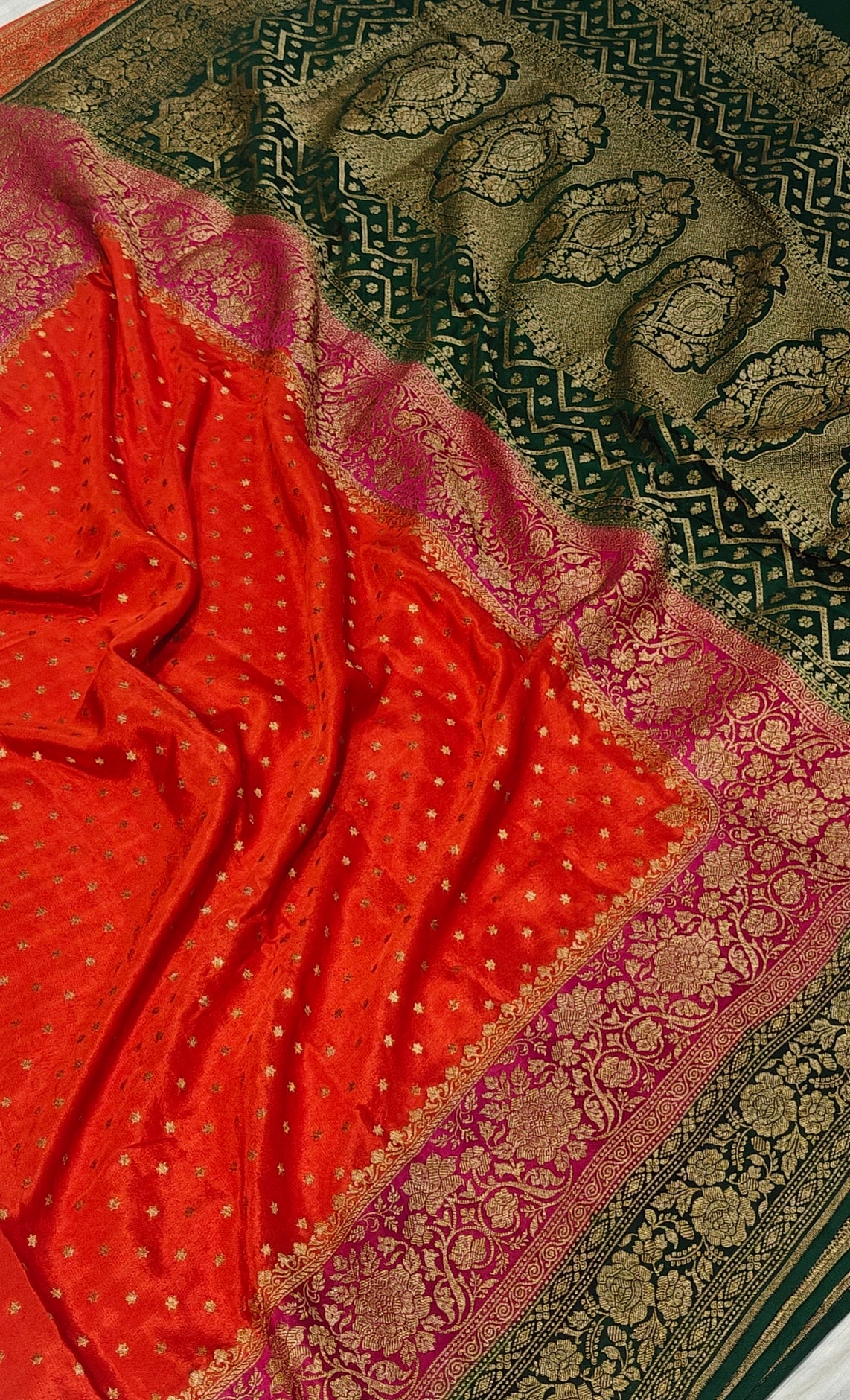 Pure khaddi crepe silk saree with 3D border in orange Rani & bottle green colour combination