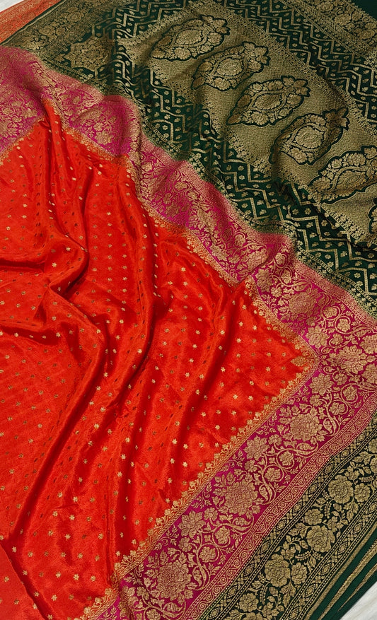 Pure khaddi crepe silk saree with 3D border in orange Rani & bottle green colour combination