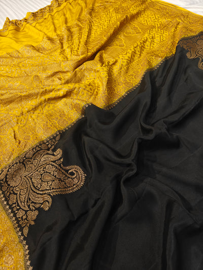Pure khaddi crepe silk saree in black and mustard colour combination with pure antic zari work